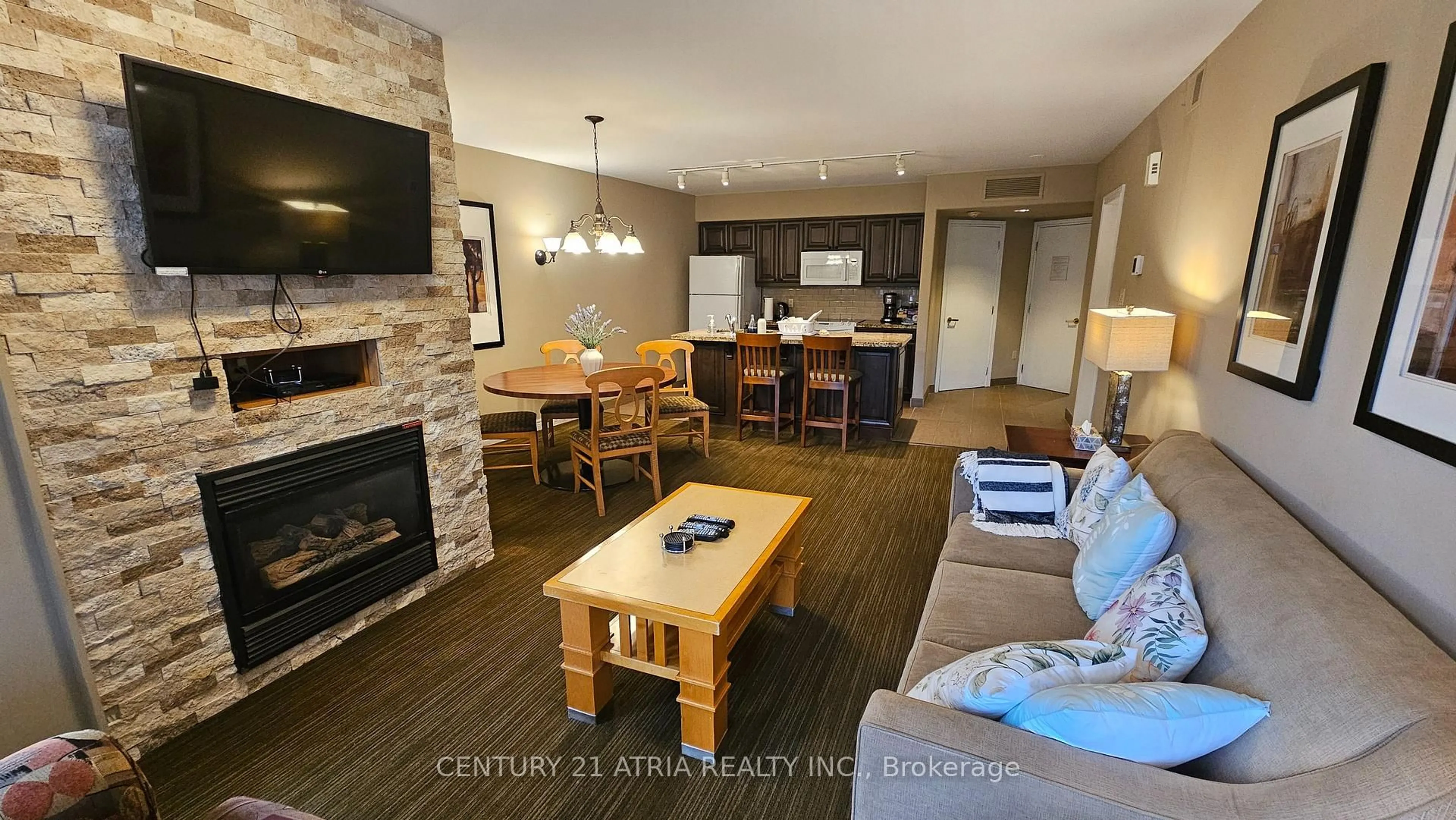 Living room with furniture, wood/laminate floor for 90 Highland Dr #2074/75, Oro-Medonte Ontario L0L 2L0