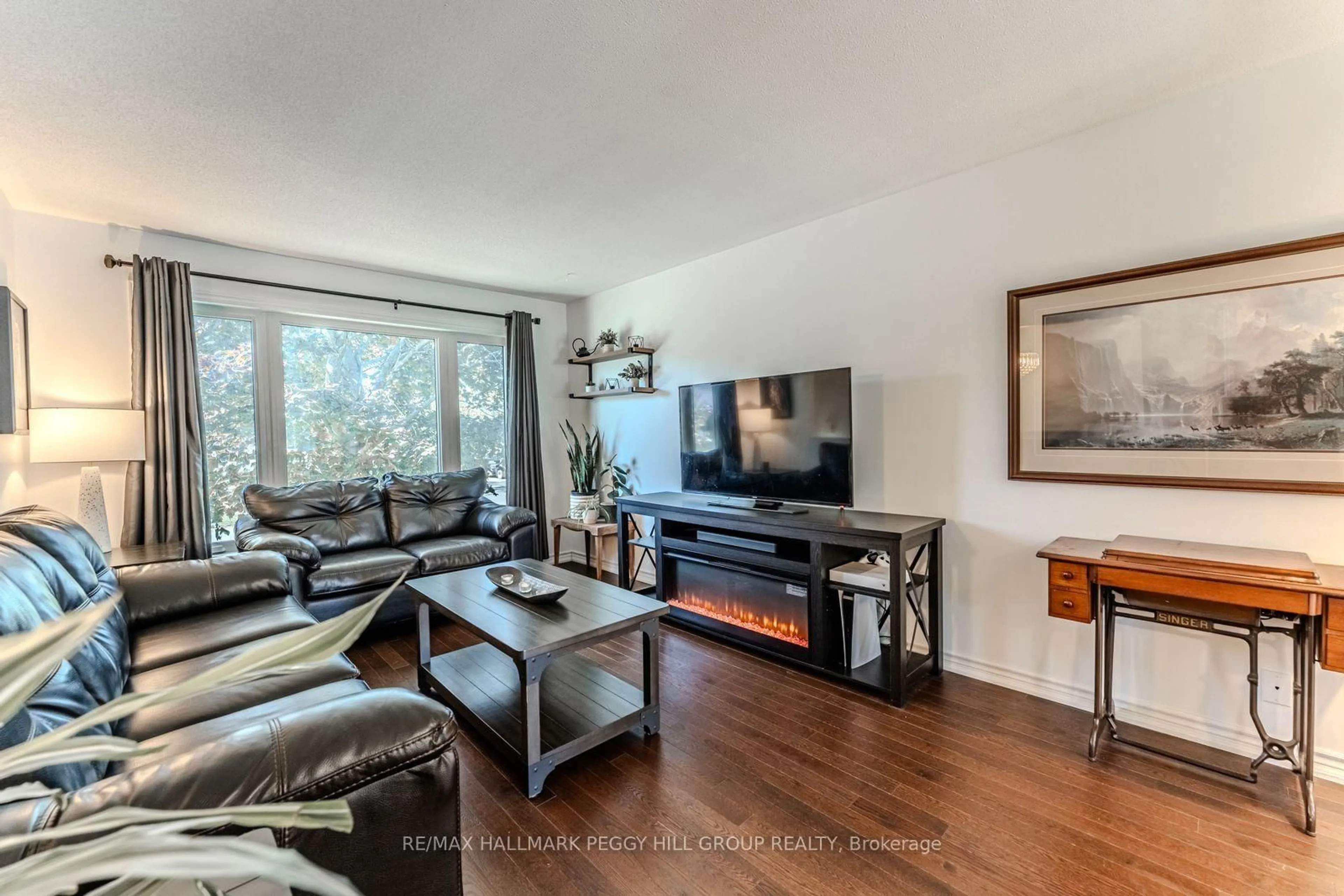 Living room with furniture, wood/laminate floor for 2 Carmichael Crt, Orillia Ontario L3V 7R6
