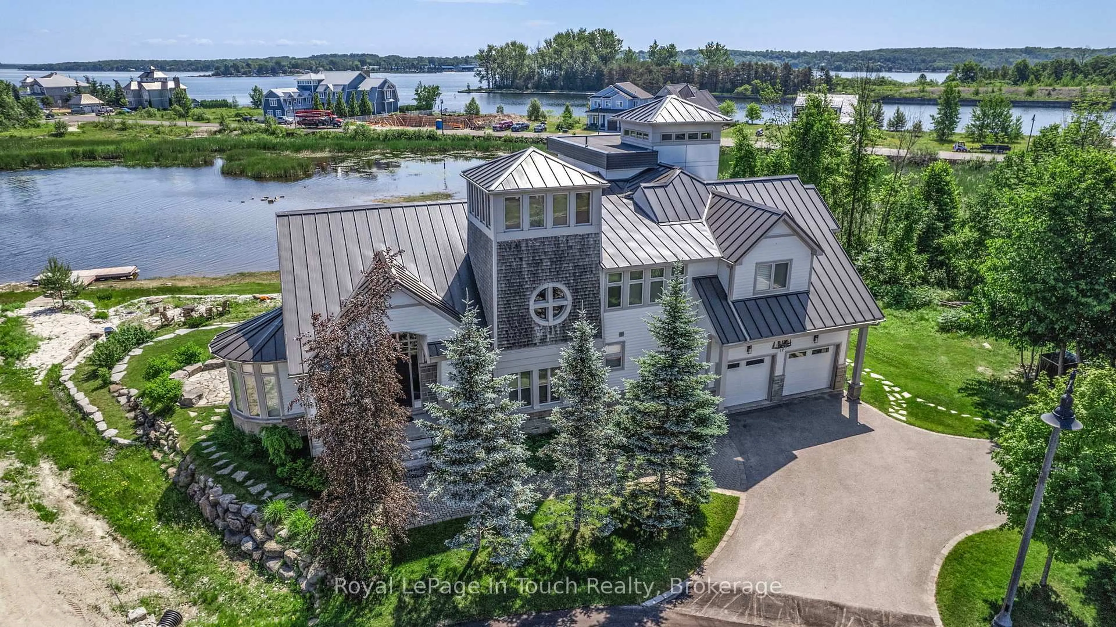 A pic from outside/outdoor area/front of a property/back of a property/a pic from drone, water/lake/river/ocean view for 17 Swan Lane, Tay Ontario L0K 1R0