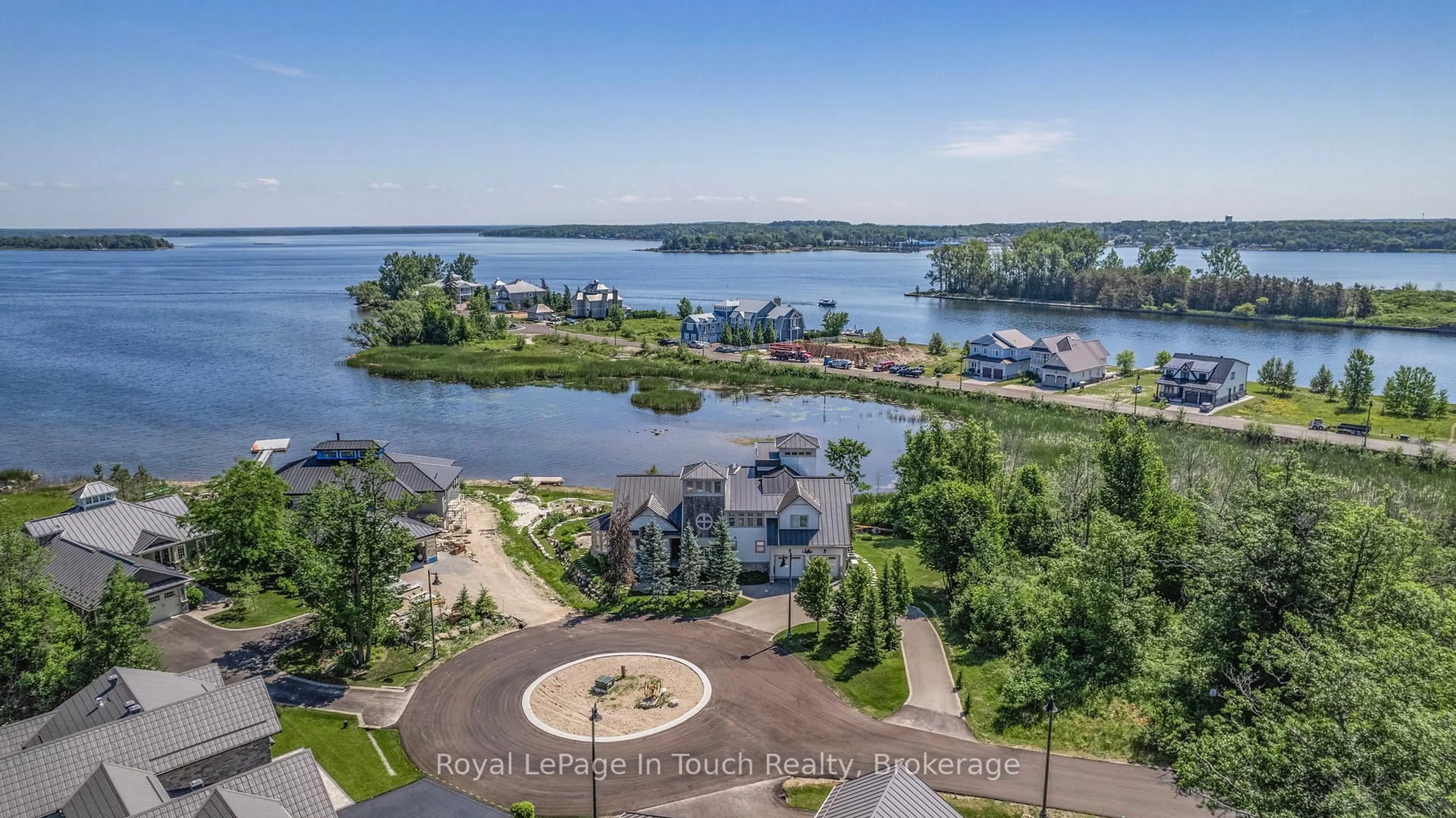 A pic from outside/outdoor area/front of a property/back of a property/a pic from drone, water/lake/river/ocean view for 17 Swan Lane, Tay Ontario L0K 1R0