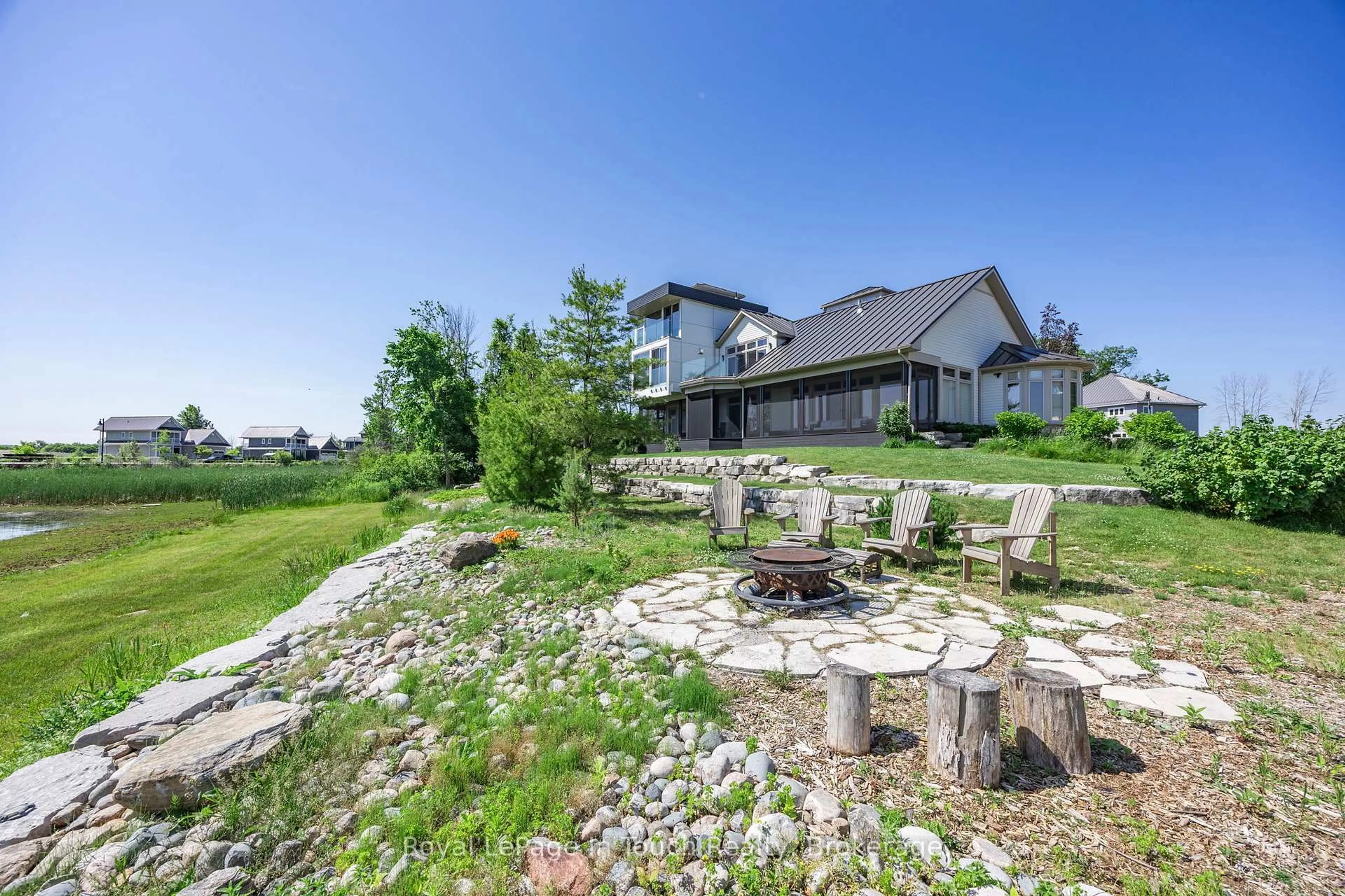 A pic from outside/outdoor area/front of a property/back of a property/a pic from drone, mountain view for 17 Swan Lane, Tay Ontario L0K 1R0