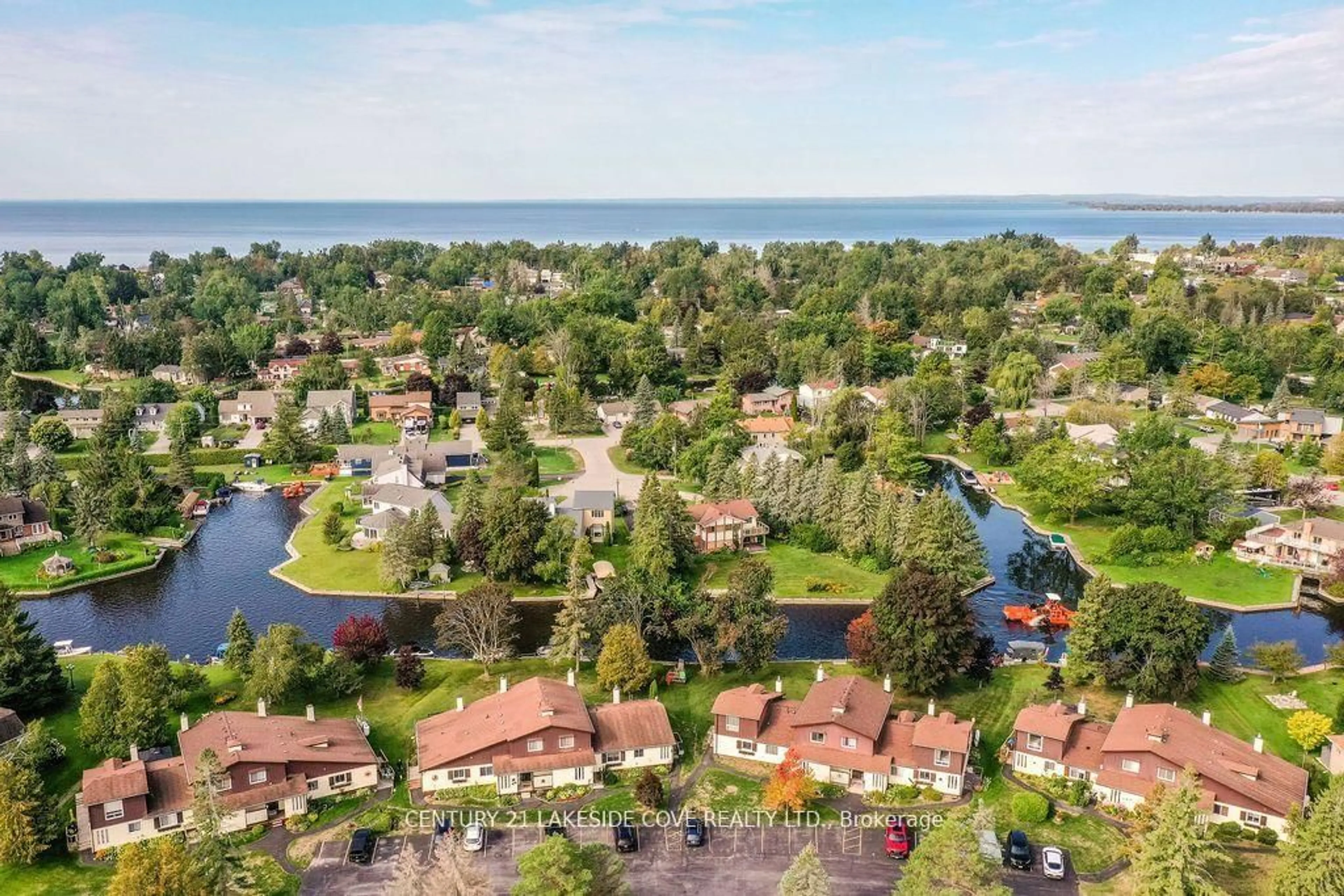 A pic from outside/outdoor area/front of a property/back of a property/a pic from drone, water/lake/river/ocean view for 70 Laguna Pkwy #Unit #7, Ramara Ontario L0K 1B0