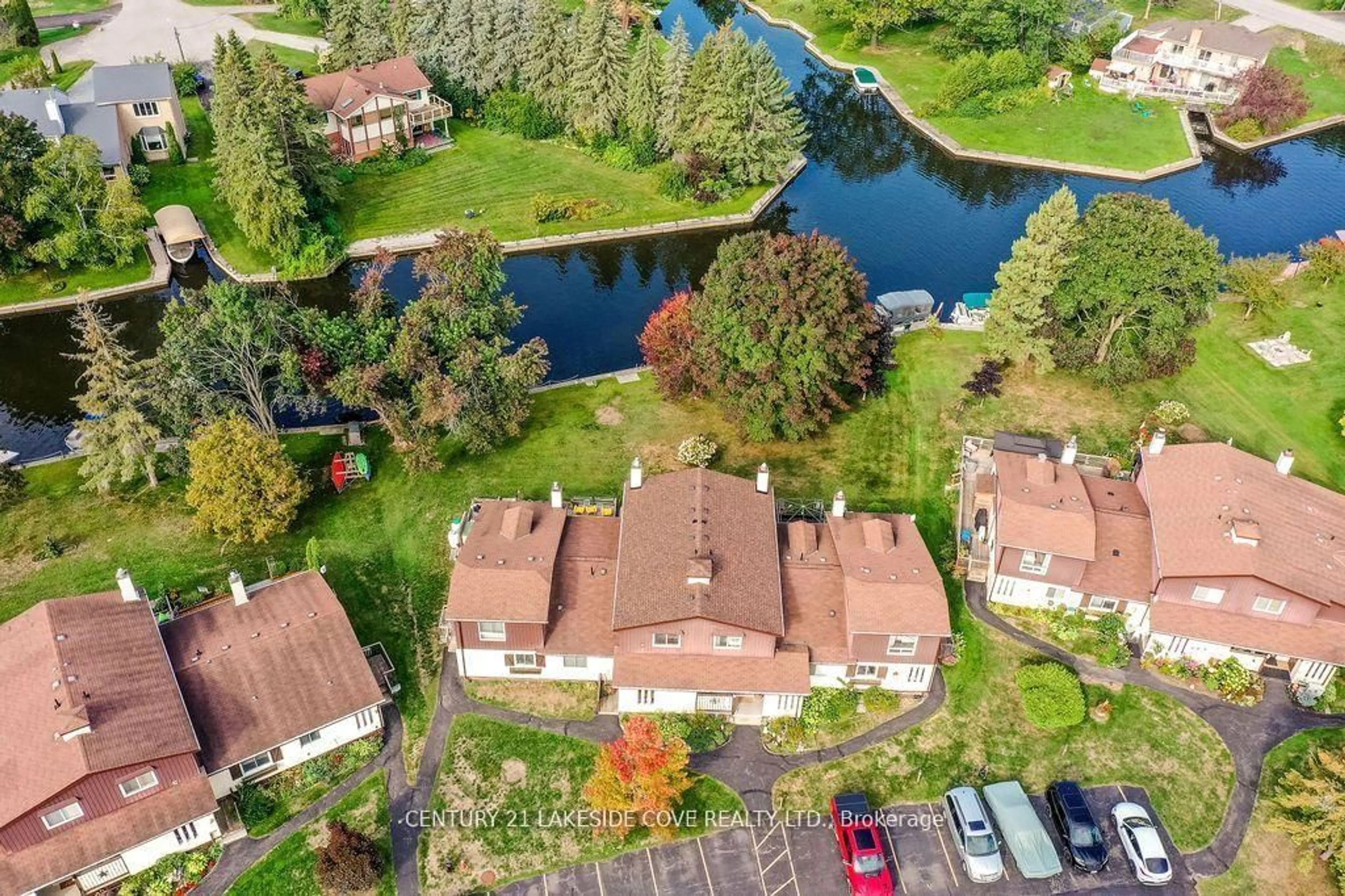 A pic from outside/outdoor area/front of a property/back of a property/a pic from drone, water/lake/river/ocean view for 70 Laguna Pkwy #Unit #7, Ramara Ontario L0K 1B0