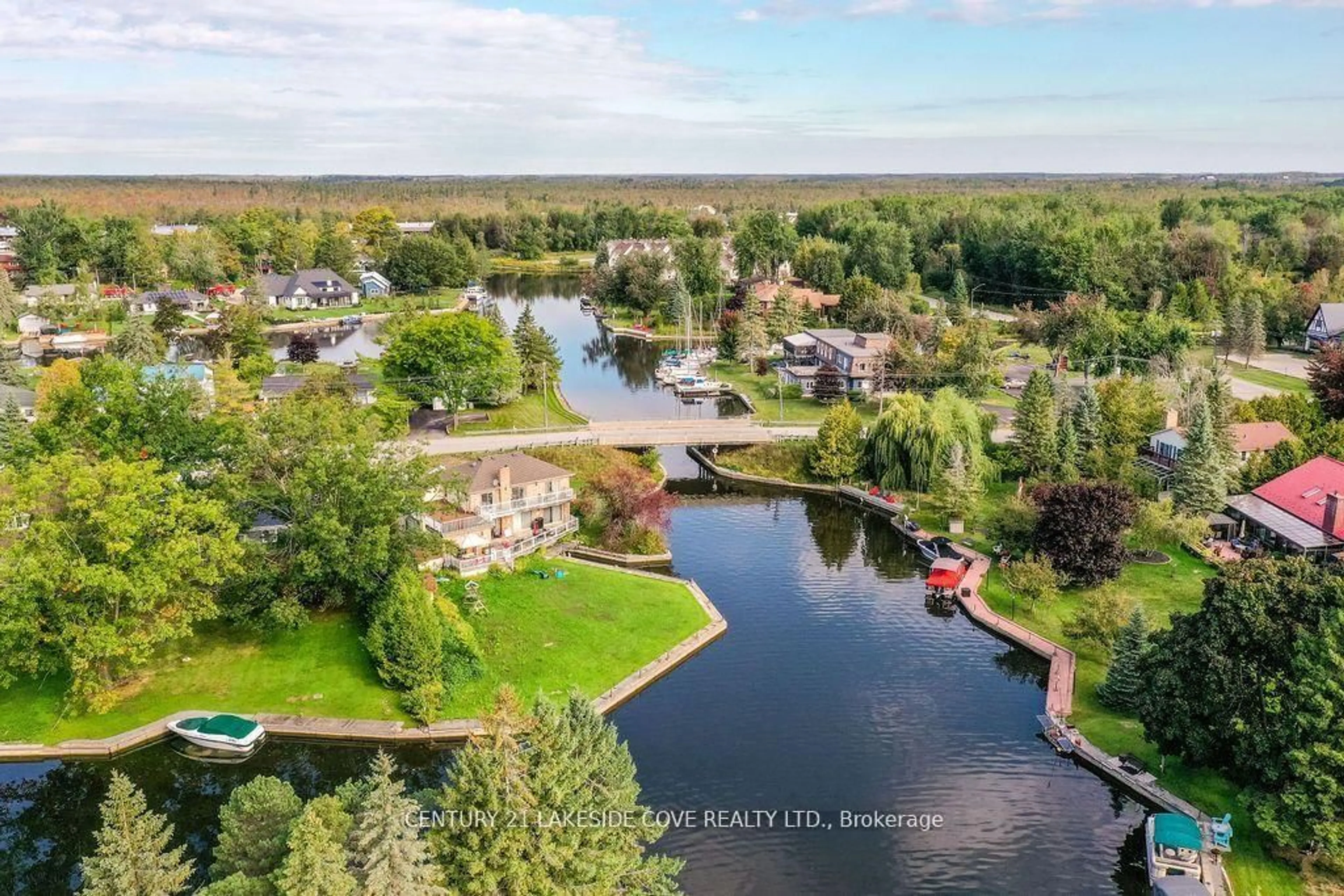 A pic from outside/outdoor area/front of a property/back of a property/a pic from drone, water/lake/river/ocean view for 70 Laguna Pkwy #Unit #7, Ramara Ontario L0K 1B0