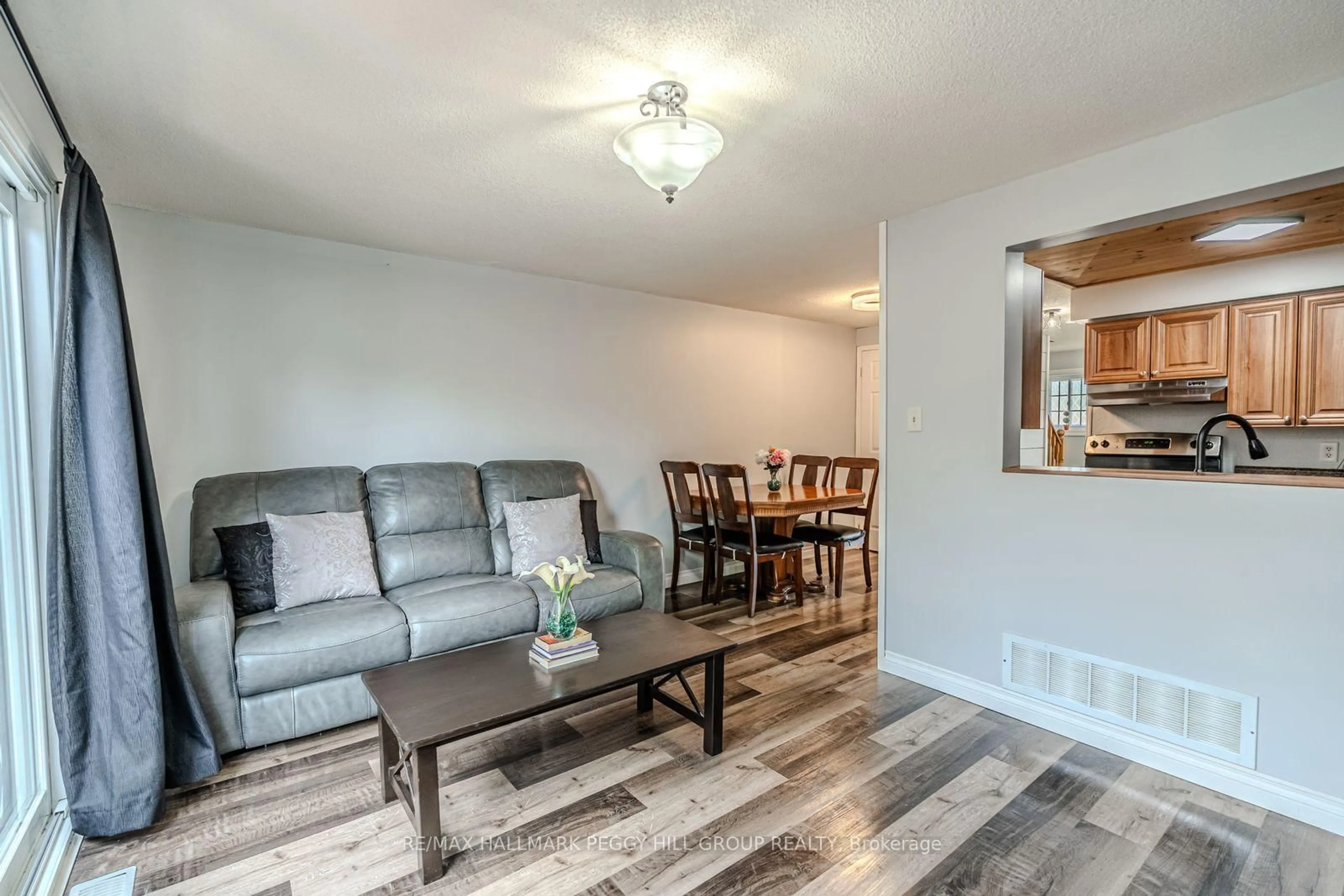 Living room with furniture, wood/laminate floor for 193 Nathan Cres, Barrie Ontario L4N 0S4