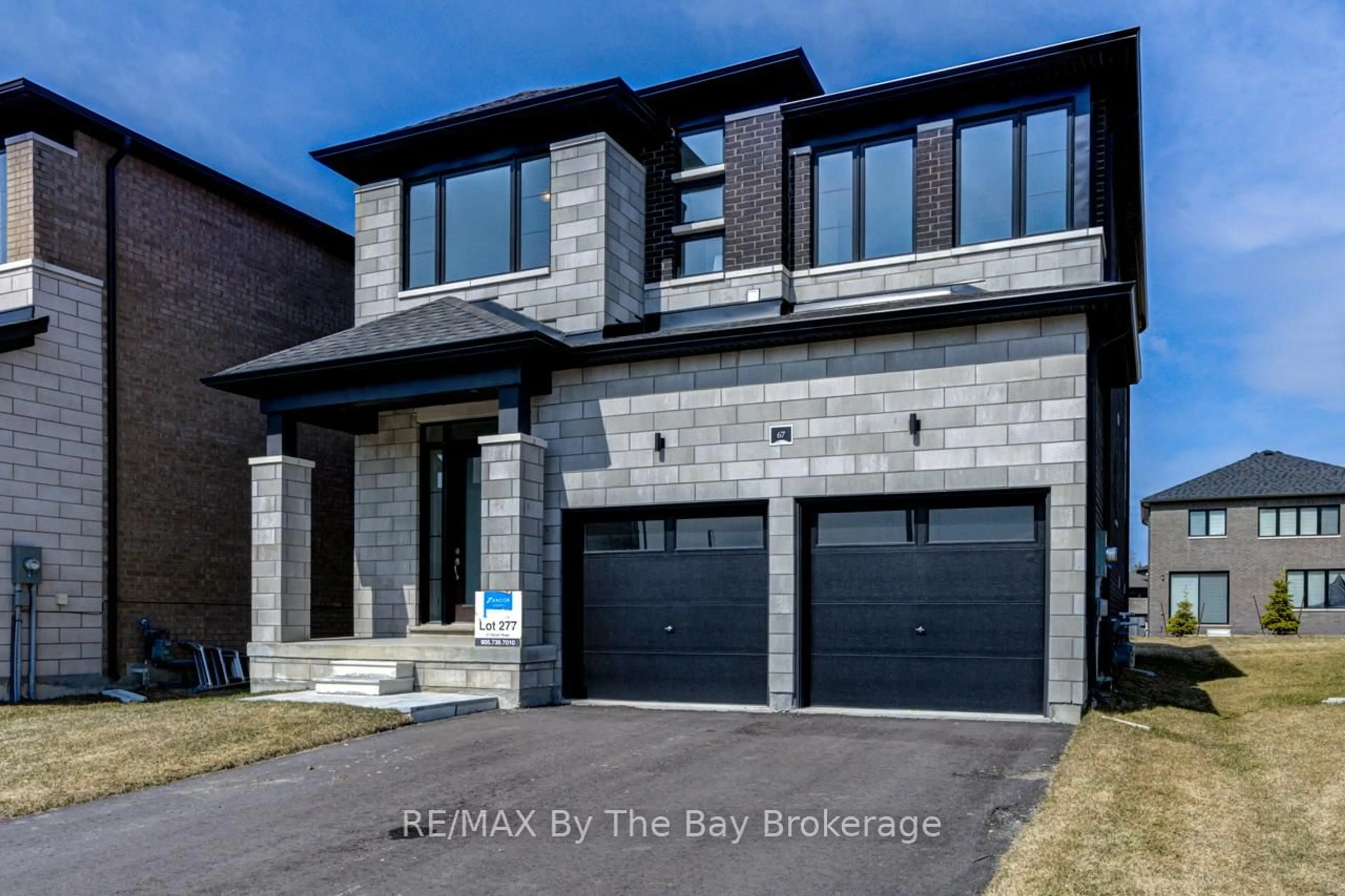 Home with brick exterior material, street for 67 Nicort Rd, Wasaga Beach Ontario L9Z 0N1