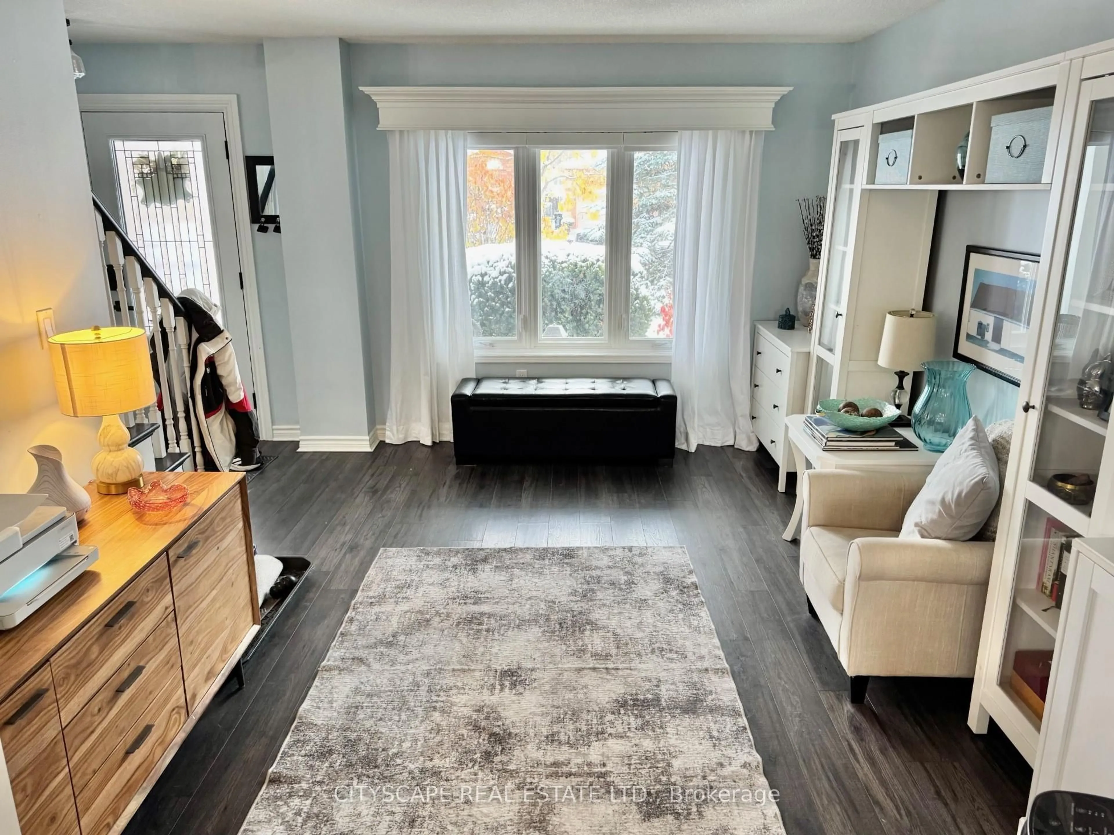 Living room with furniture, wood/laminate floor for 189 Churchland Dr, Barrie Ontario L4N 8N6