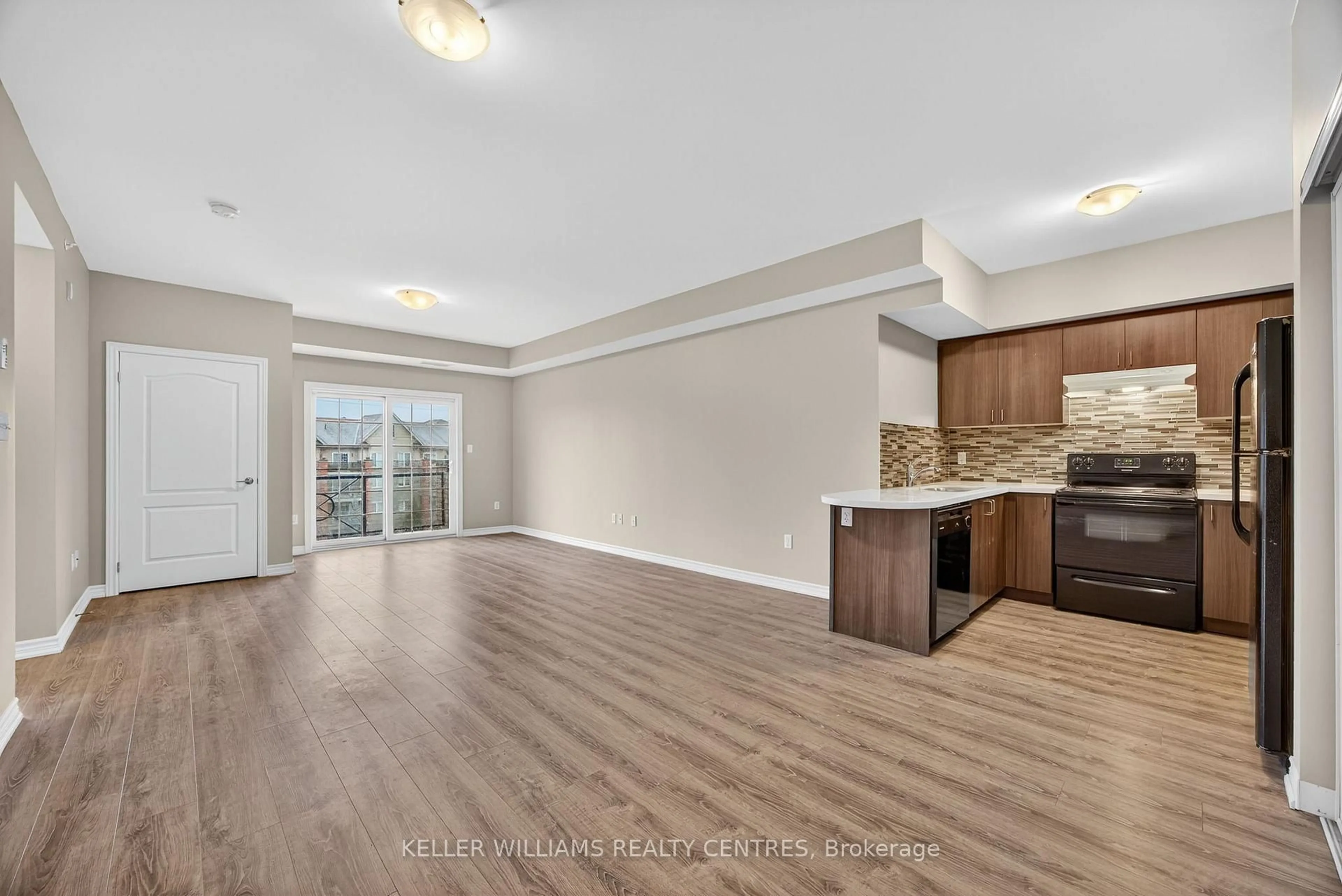 Open concept kitchen, wood/laminate floor for 40 Ferndale Dr #408, Barrie Ontario L4N 2L3