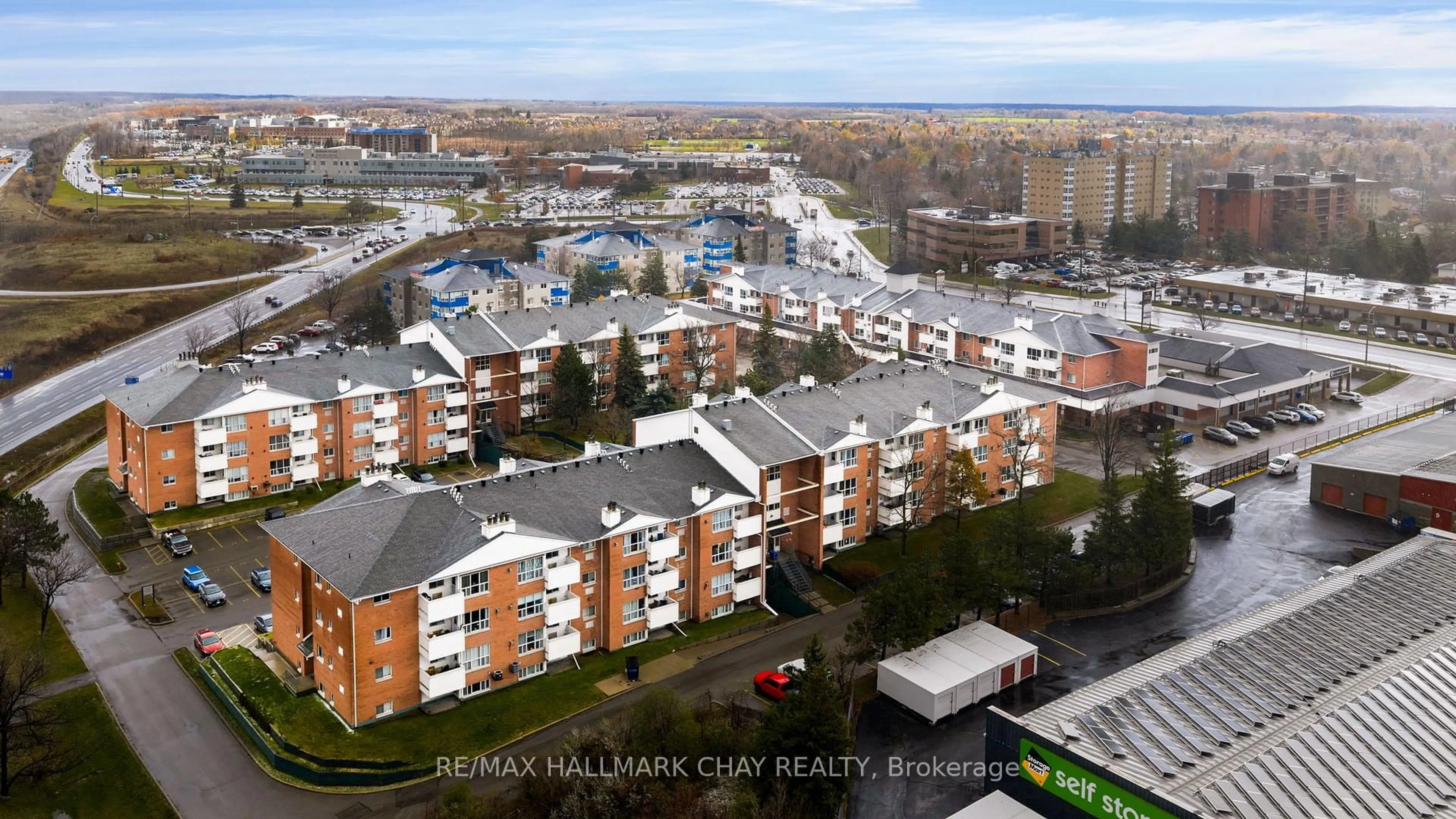 A pic from outside/outdoor area/front of a property/back of a property/a pic from drone, city buildings view from balcony for 120 Bell Farm Rd #108, Barrie Ontario L4M 6J2