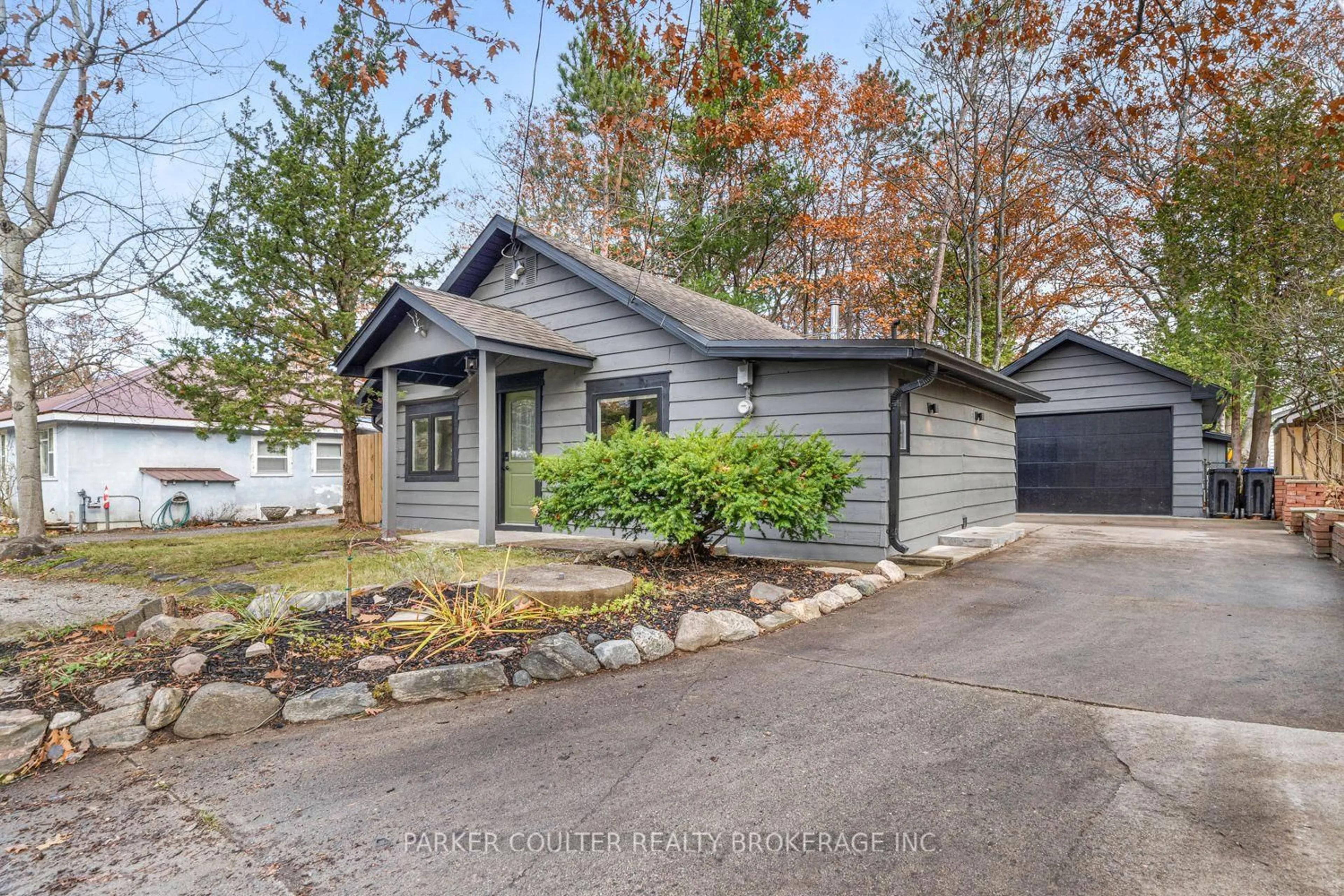 Home with vinyl exterior material, street for 283 Tiny Beaches Rd, Tiny Ontario L0L 2J0