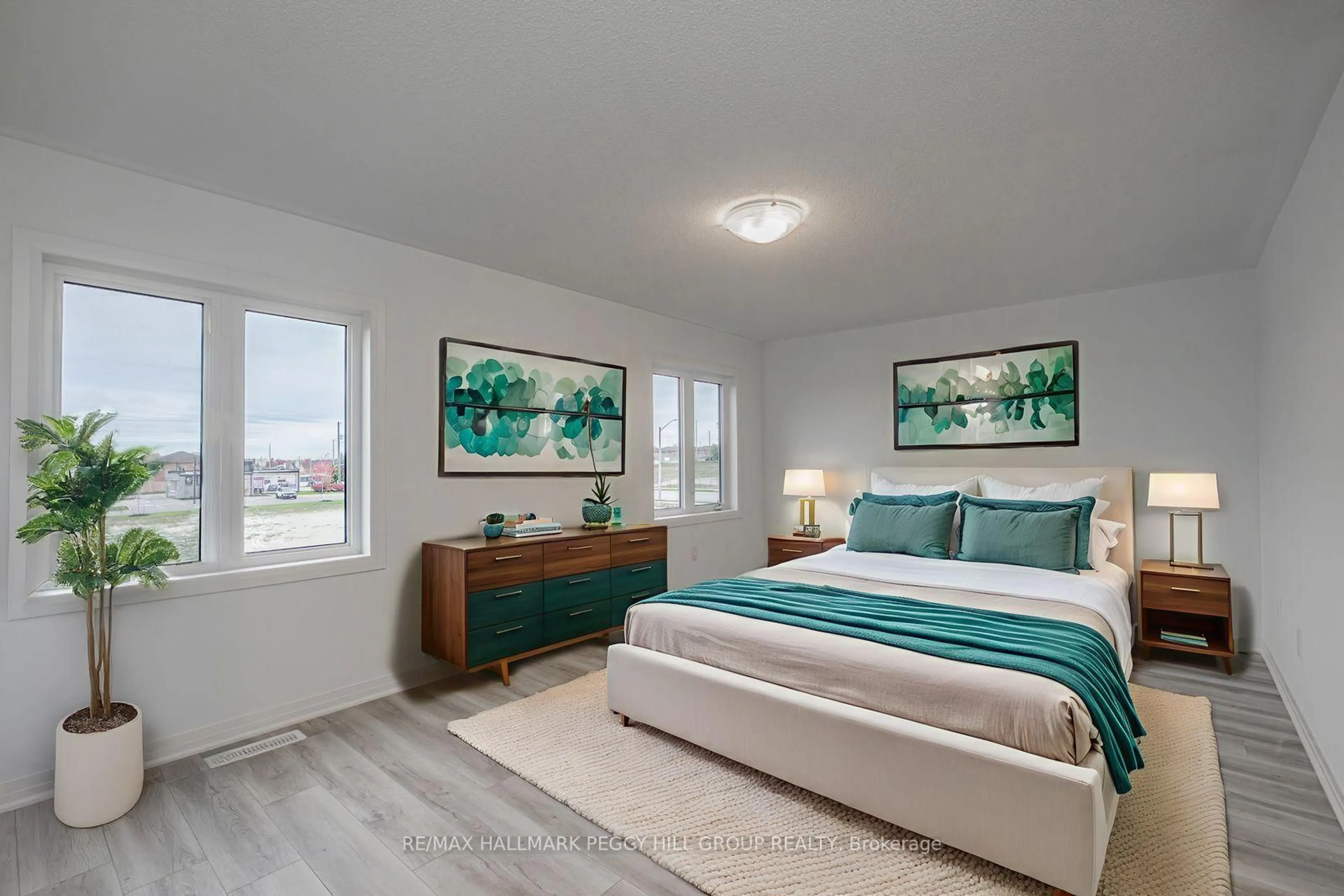 Bedroom with bed, wood/laminate floor for 55 Sagewood Ave, Barrie Ontario L9J 0K4