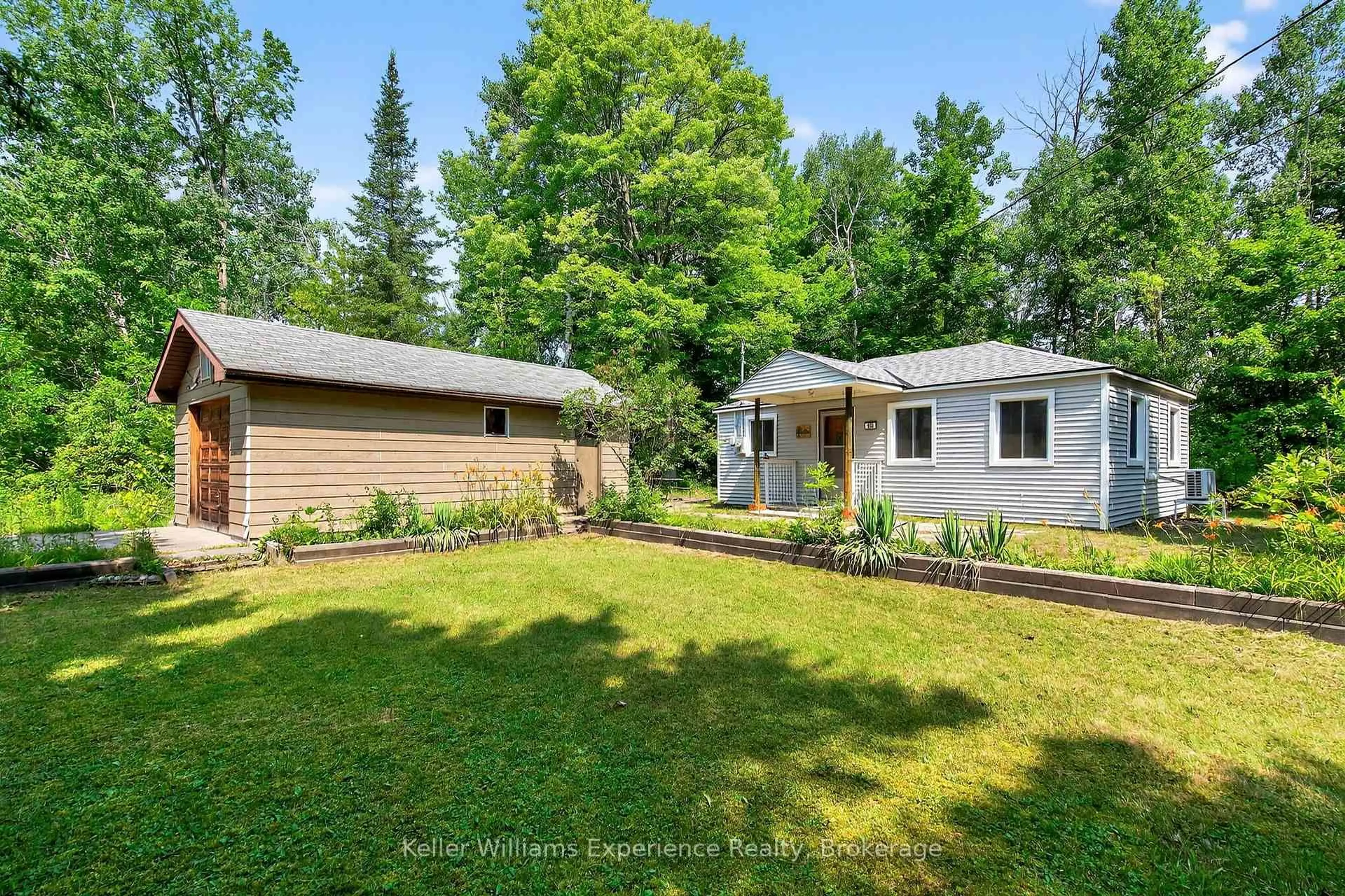 A pic from outside/outdoor area/front of a property/back of a property/a pic from drone, forest/trees view for 180&184 Silver Birch Cres, Tay Ontario L0K 1R0
