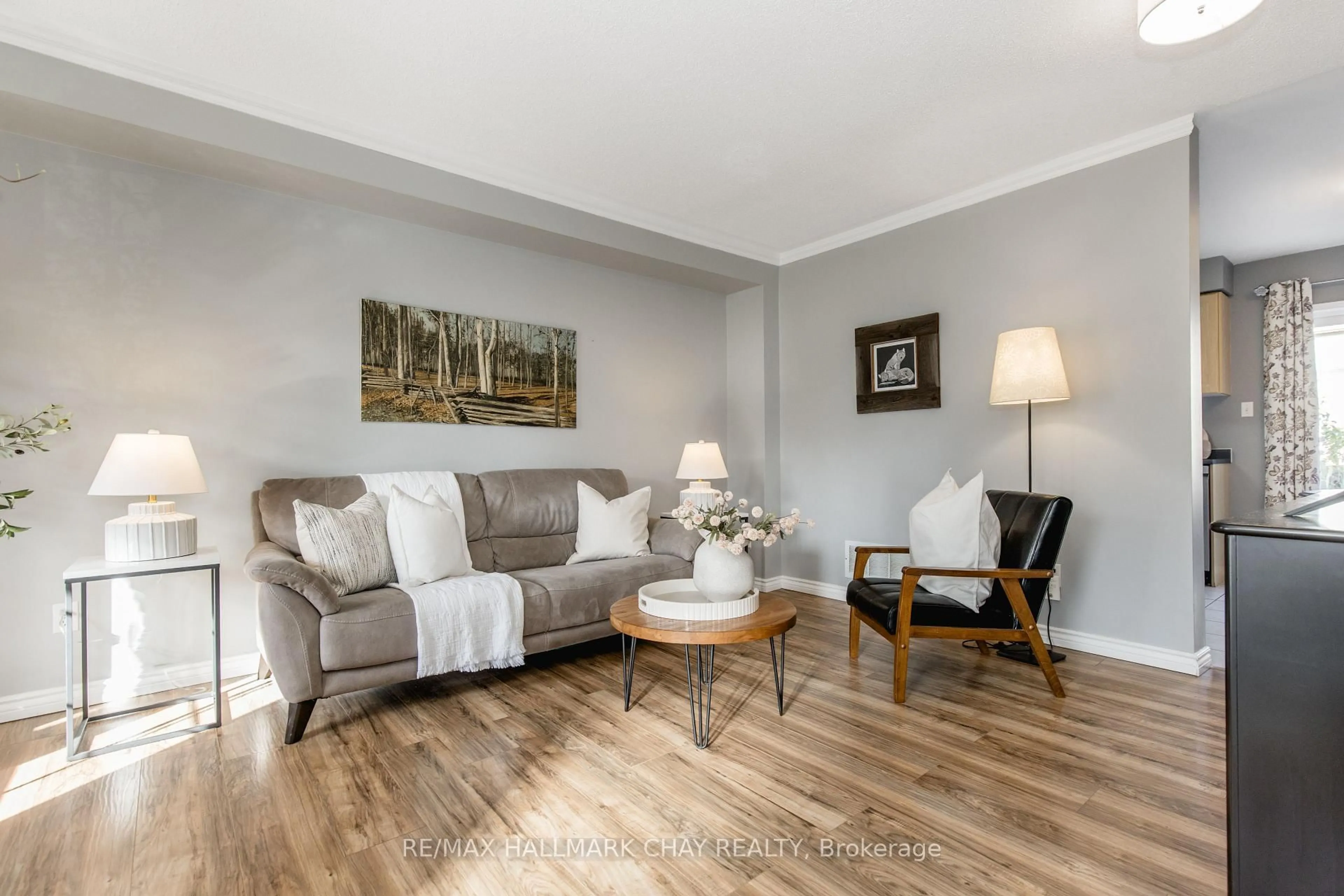 Living room with furniture, wood/laminate floor for 86 Trevino Circ, Barrie Ontario L4M 6T8