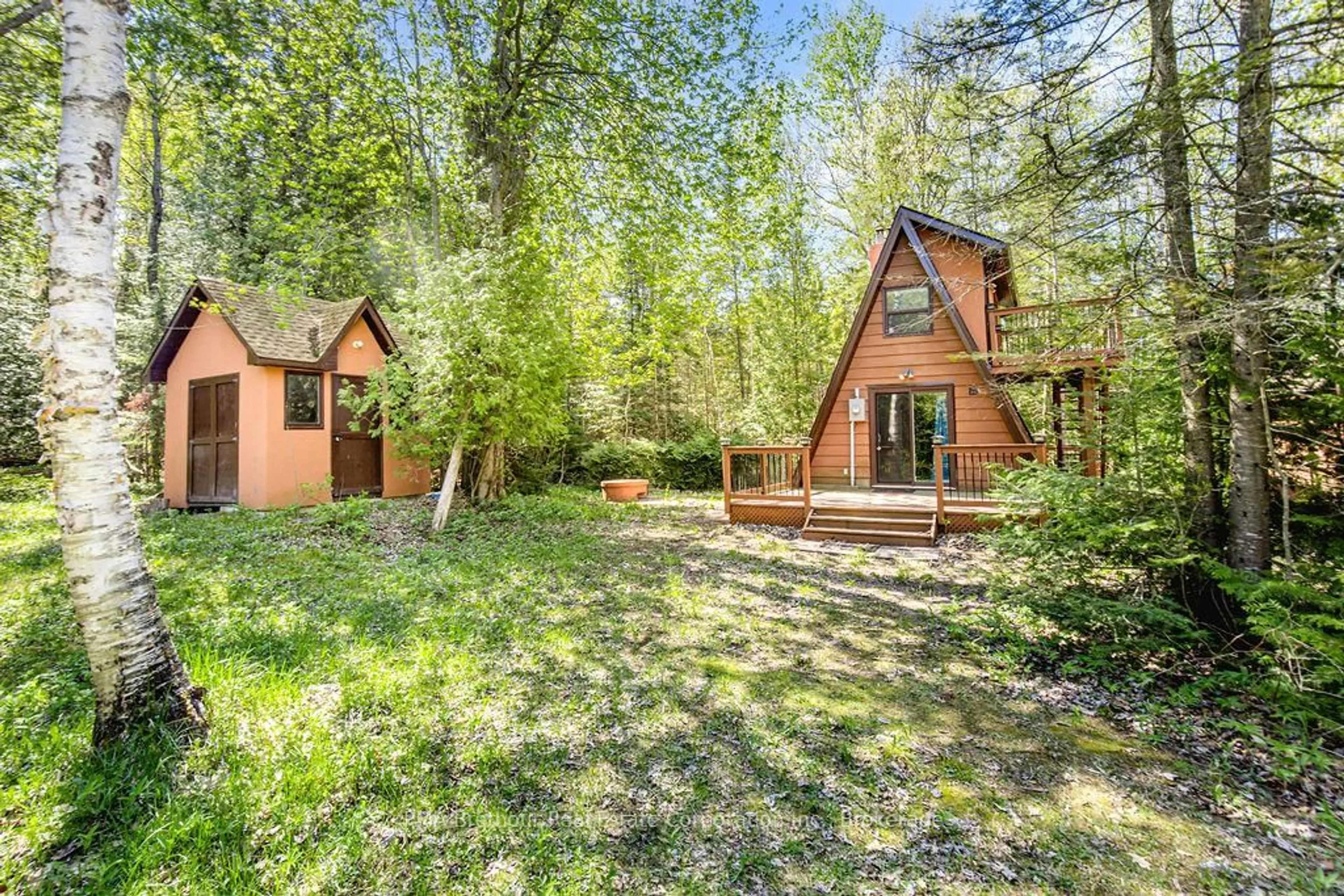 A pic from outside/outdoor area/front of a property/back of a property/a pic from drone, forest/trees view for 56 Birch Tr, Wasaga Beach Ontario L9Z 2S1