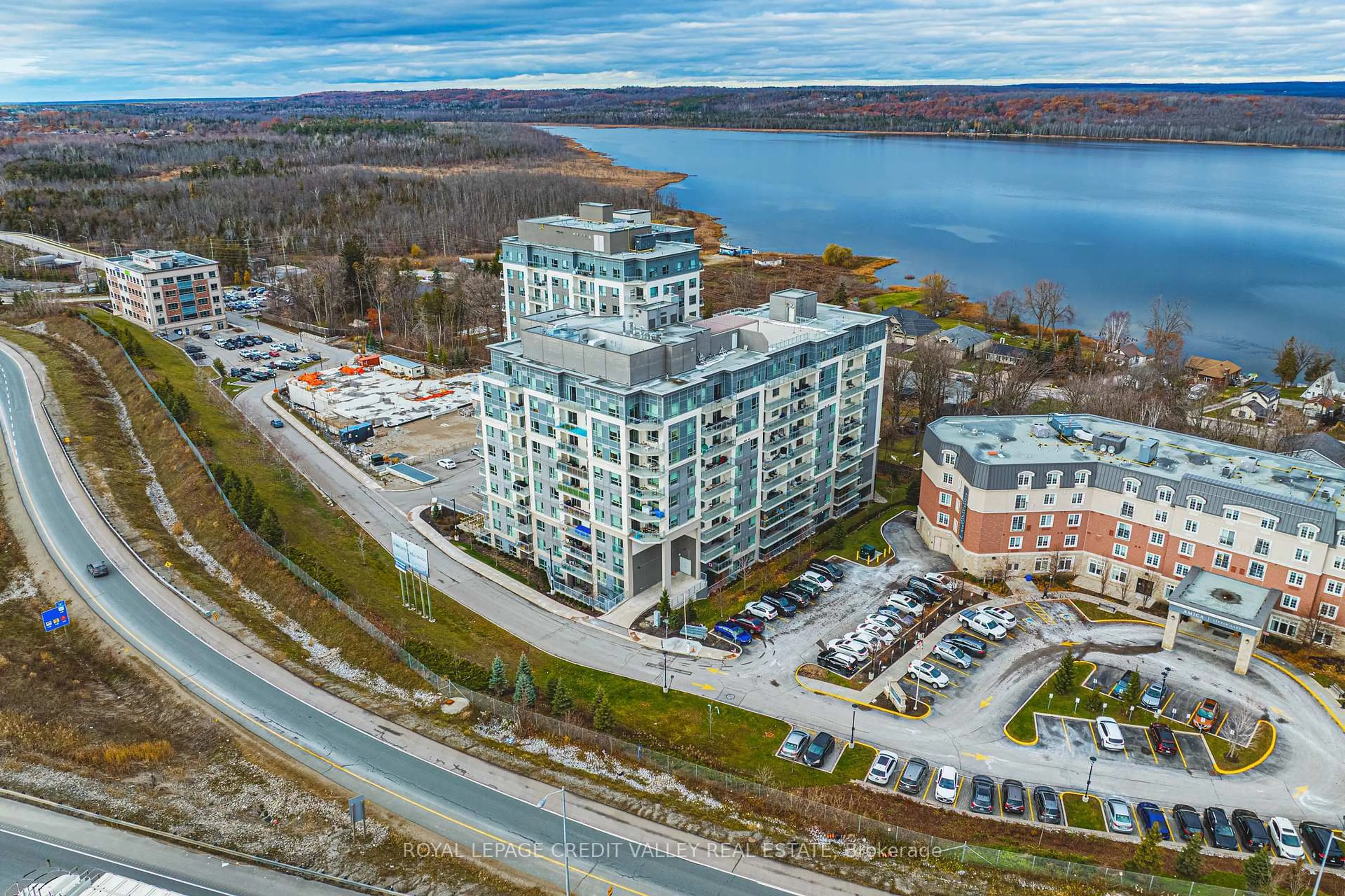 A pic from outside/outdoor area/front of a property/back of a property/a pic from drone, water/lake/river/ocean view for 58 Lakeside Terr #317, Barrie Ontario L4M 0L5