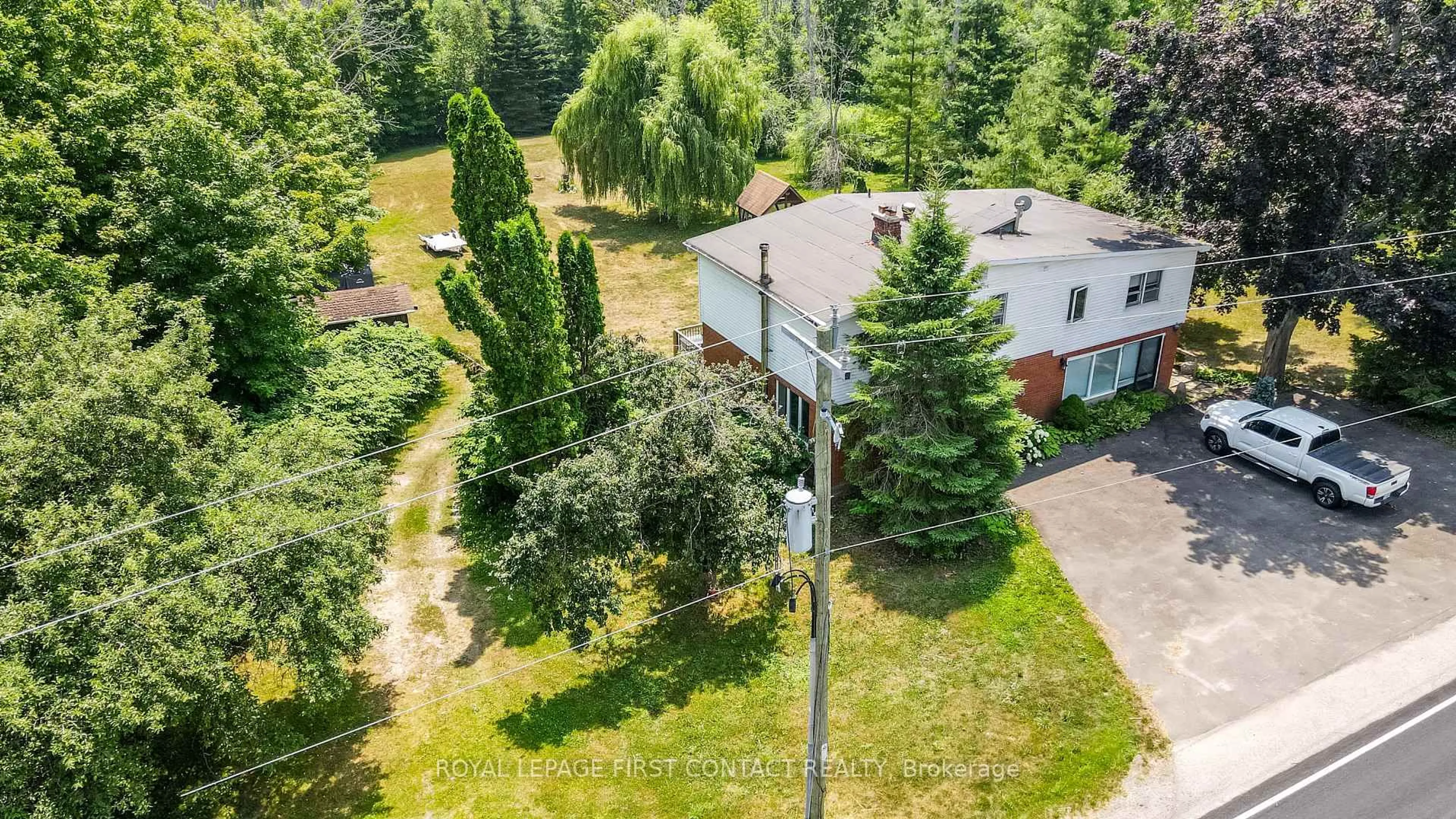 A pic from outside/outdoor area/front of a property/back of a property/a pic from drone, street for 953 Ridge Rd, Oro-Medonte Ontario L0L 2E0
