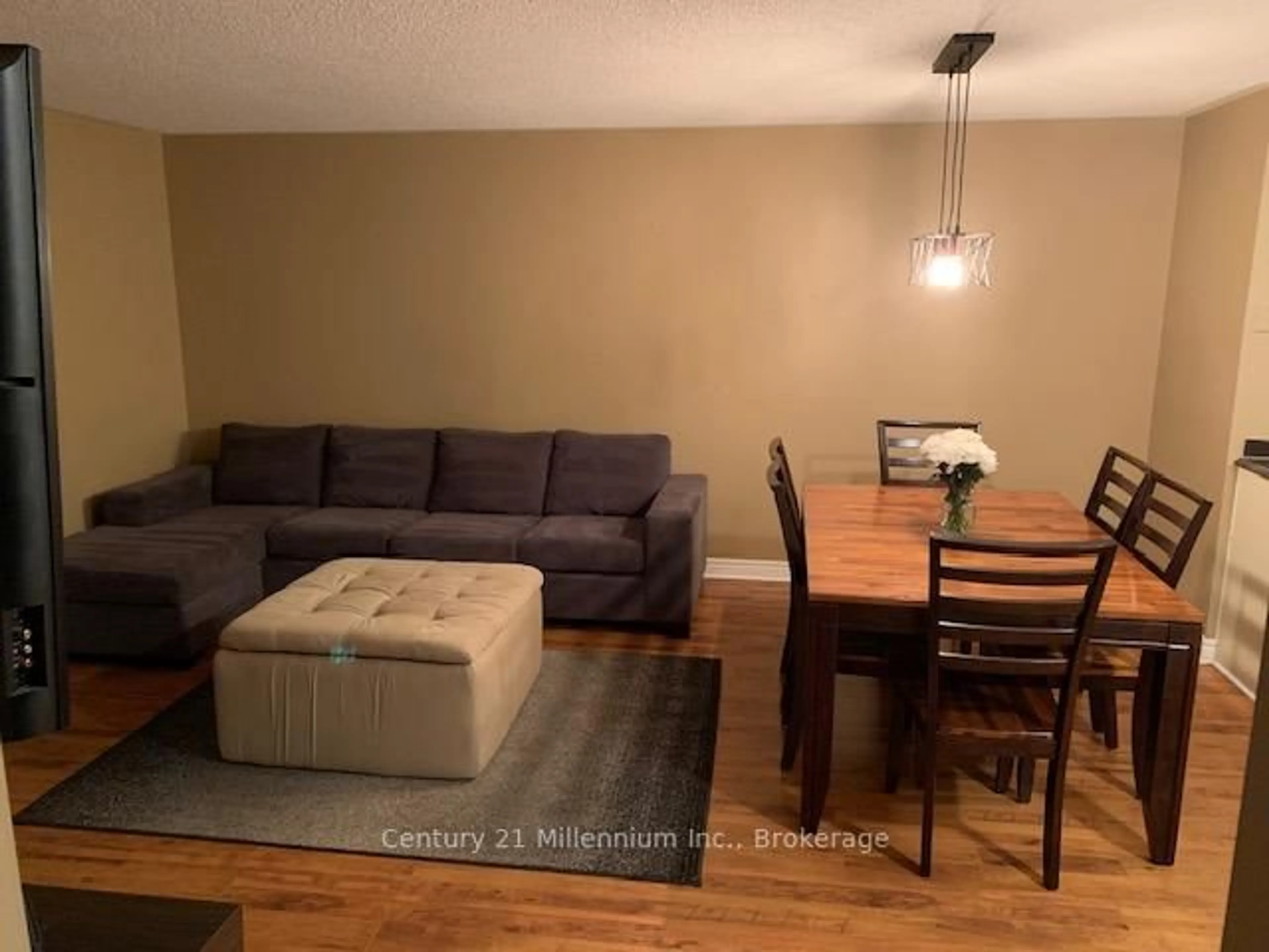 Living room with furniture, wood/laminate floor for 34 Dawson Dr #825, Collingwood Ontario L9Y 5B4