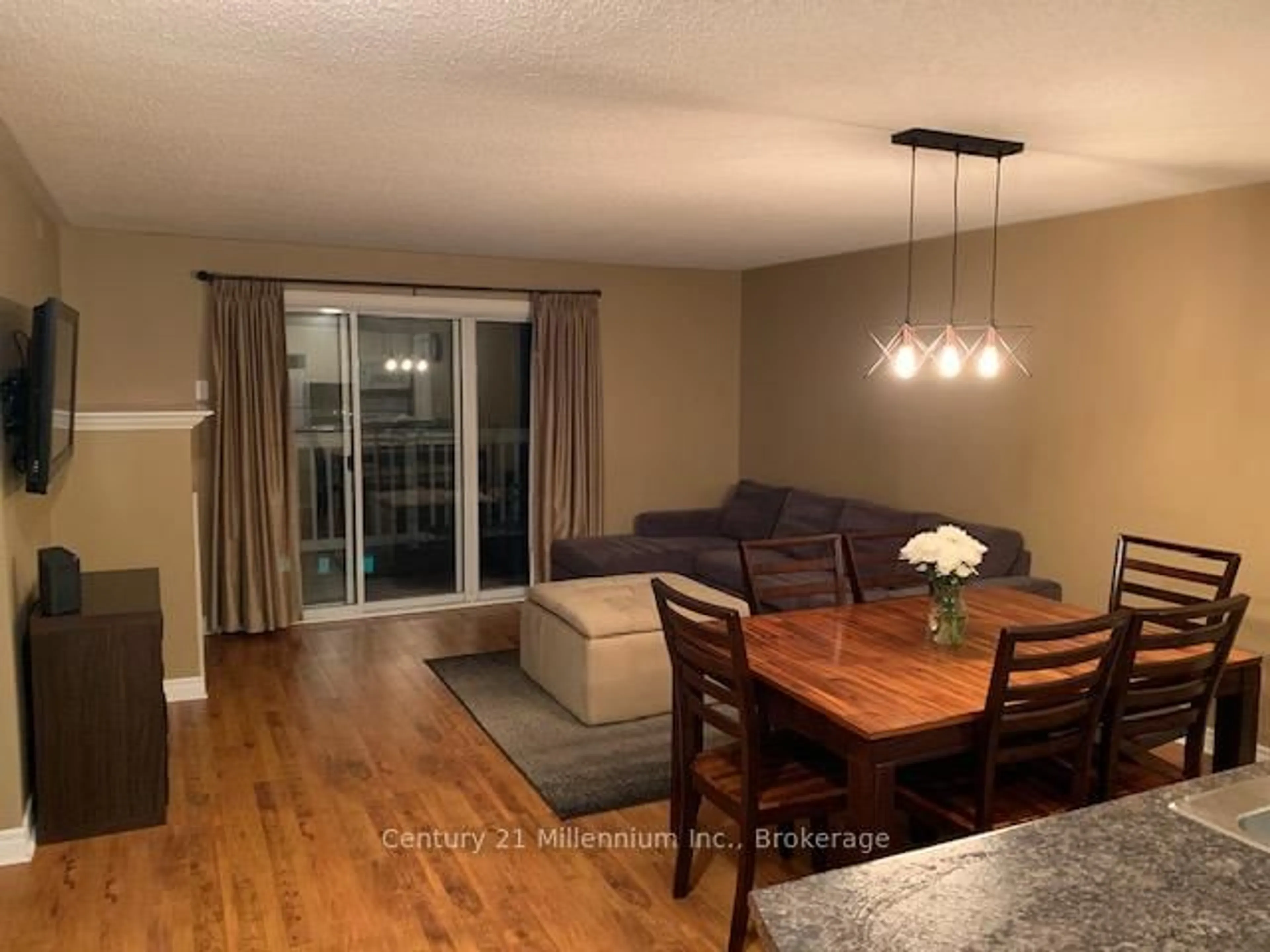Living room with furniture, wood/laminate floor for 34 Dawson Dr #825, Collingwood Ontario L9Y 5B4