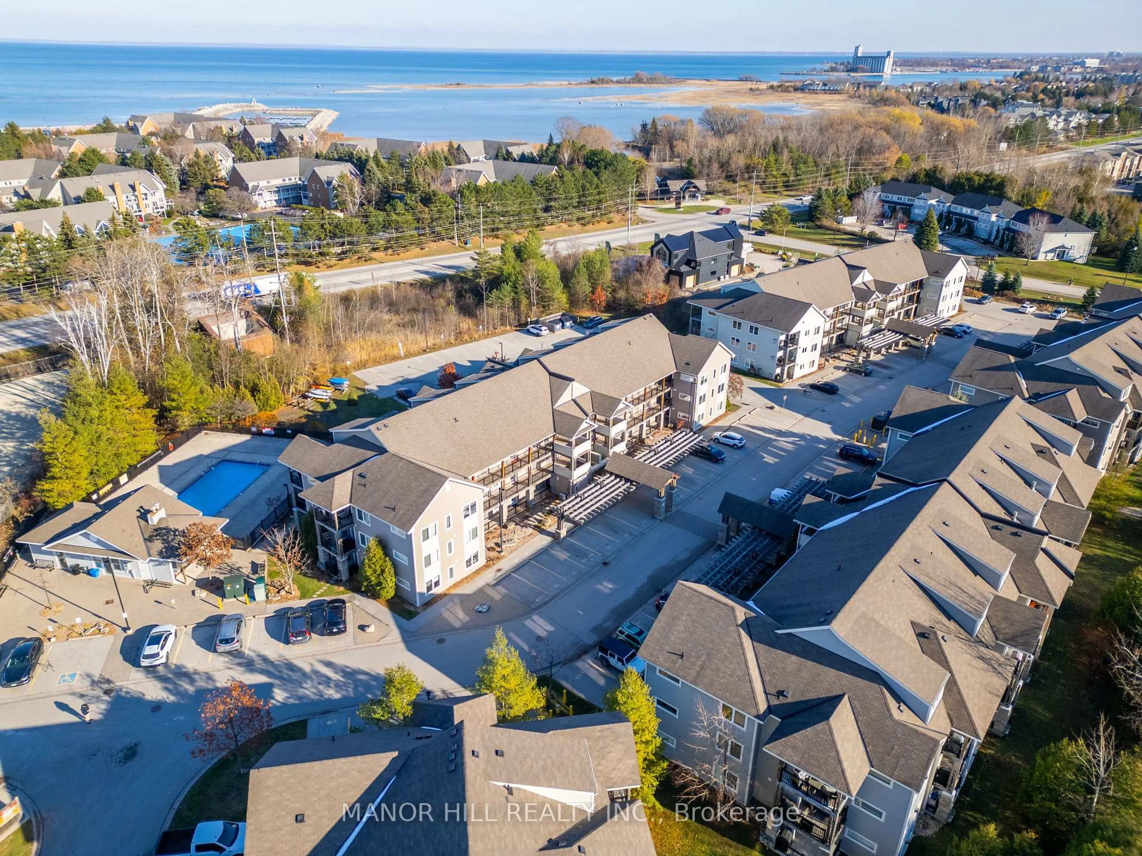 A pic from outside/outdoor area/front of a property/back of a property/a pic from drone, water/lake/river/ocean view for 3 Brandy Lane Dr #205, Collingwood Ontario L9Y 0X4