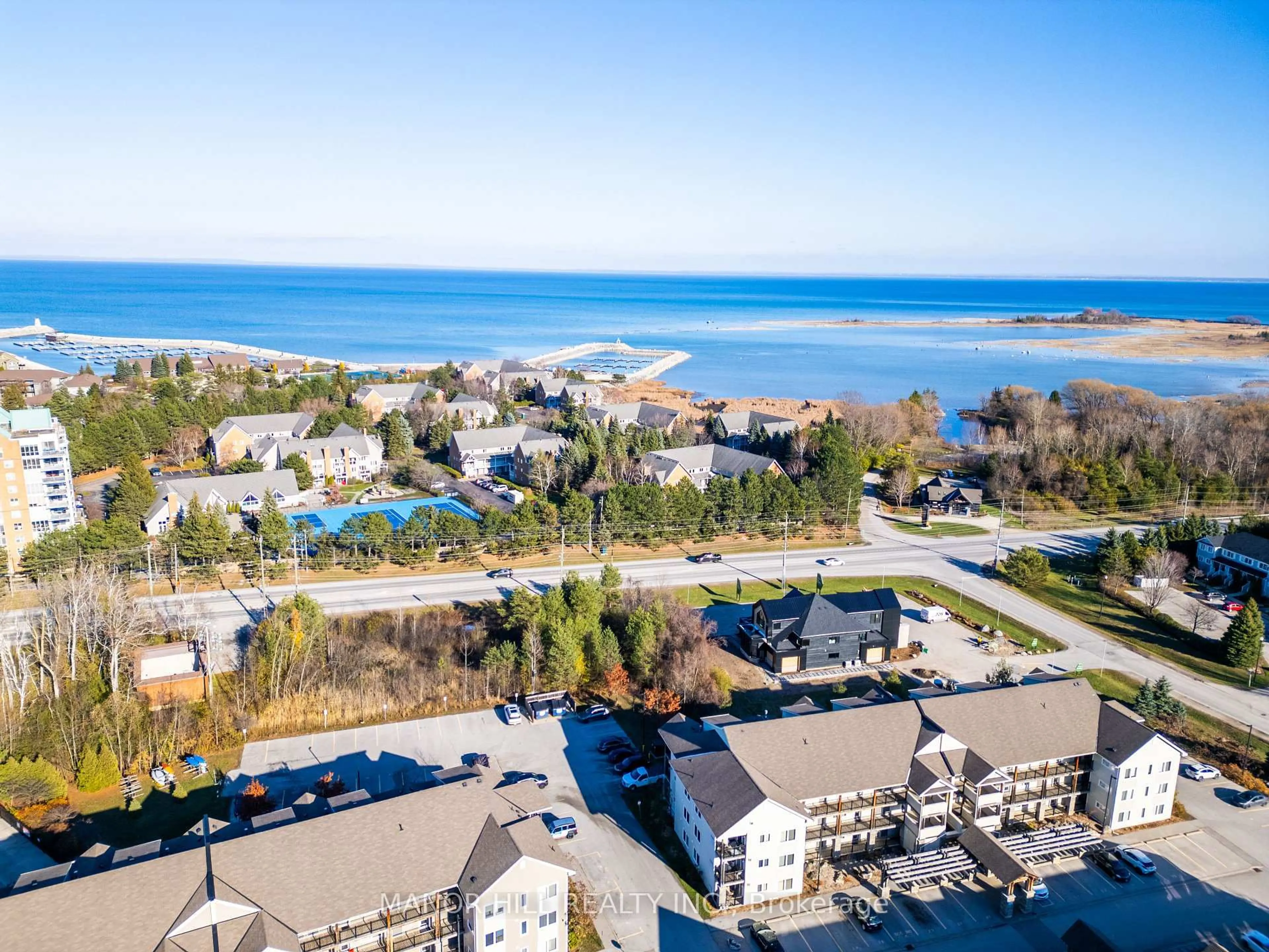 A pic from outside/outdoor area/front of a property/back of a property/a pic from drone, water/lake/river/ocean view for 3 Brandy Lane Dr #205, Collingwood Ontario L9Y 0X4