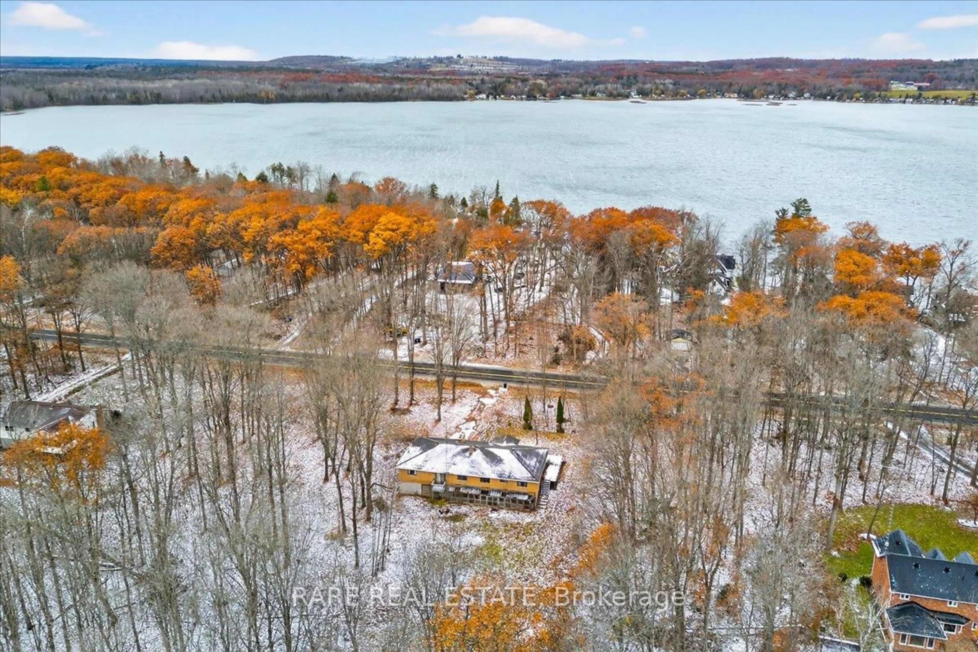 A pic from outside/outdoor area/front of a property/back of a property/a pic from drone, water/lake/river/ocean view for 2211 South Orr Lake Rd, Springwater Ontario L0L 1P0