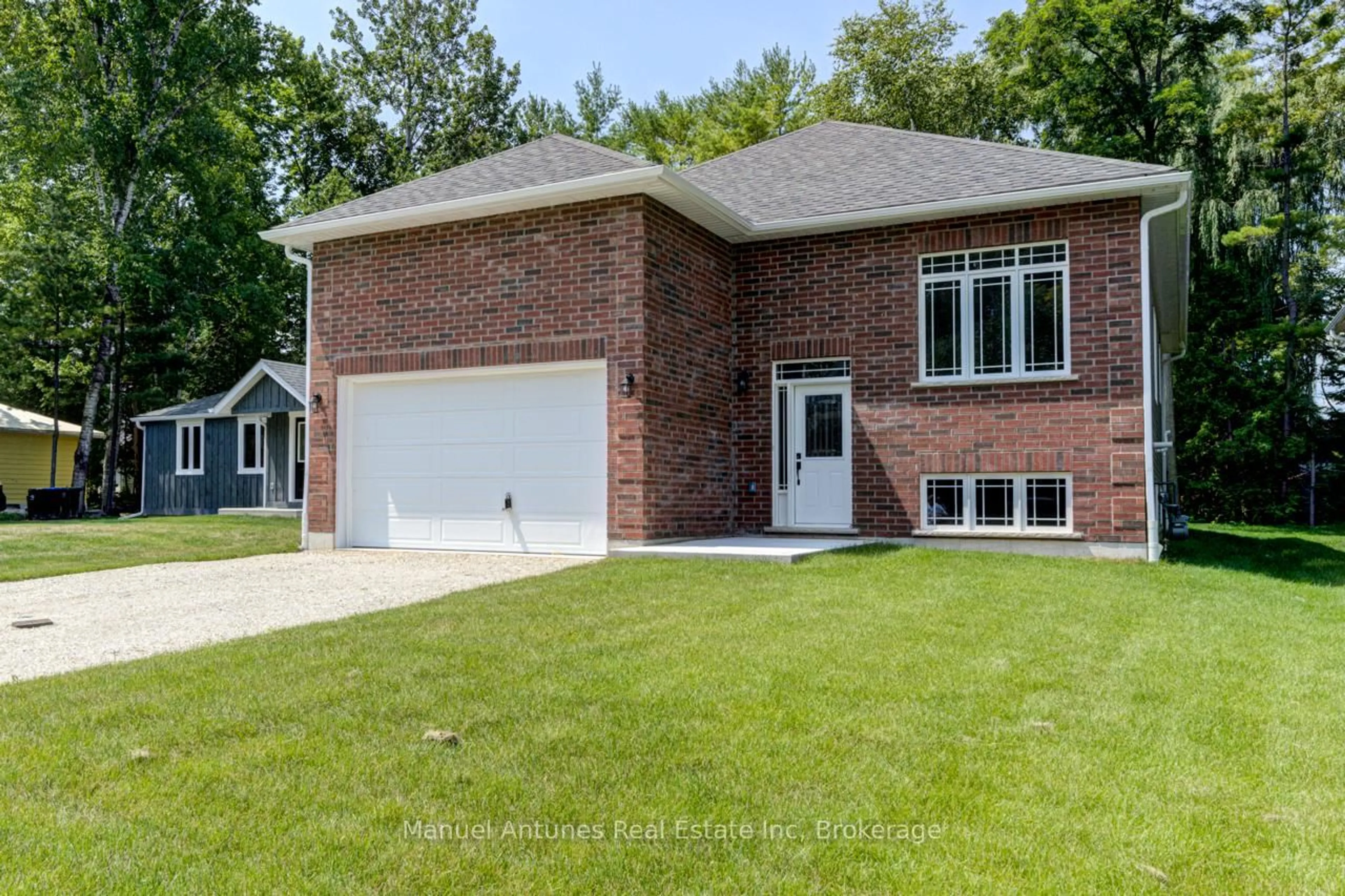 Home with brick exterior material, street for 14 56th St, Wasaga Beach Ontario L9Z 1W5