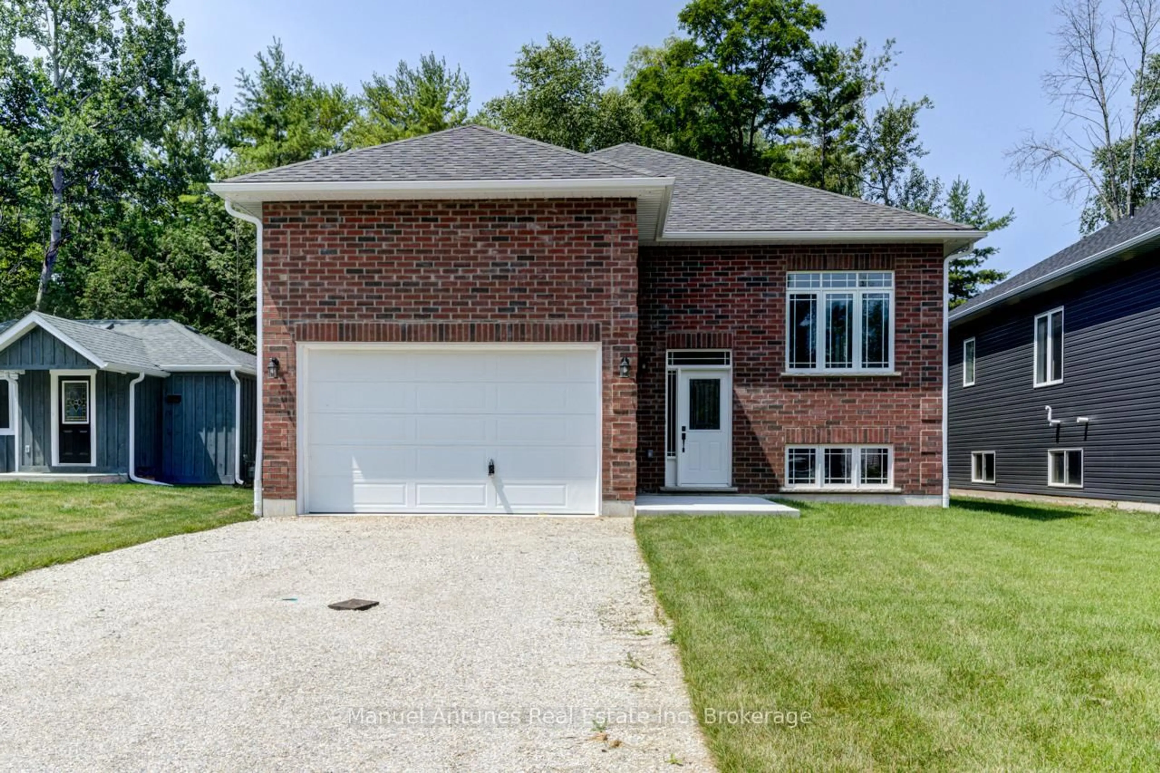 Home with brick exterior material, street for 14 56th St, Wasaga Beach Ontario L9Z 1W5