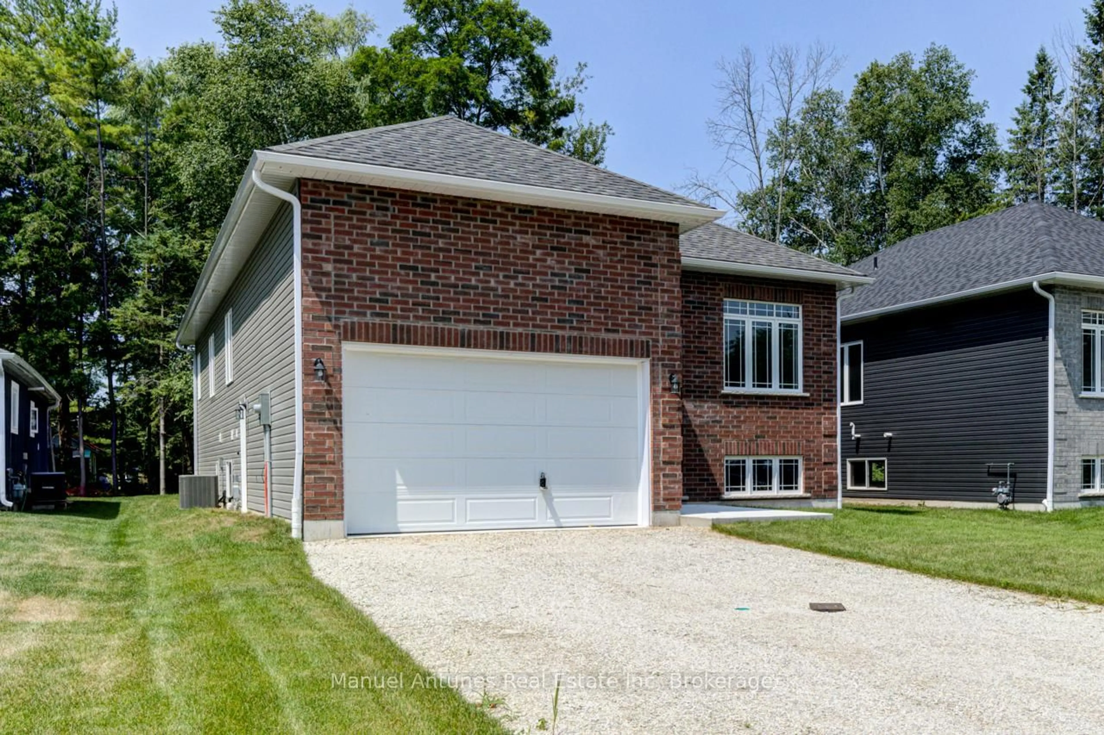 Home with brick exterior material, street for 14 56th St, Wasaga Beach Ontario L9Z 1W5