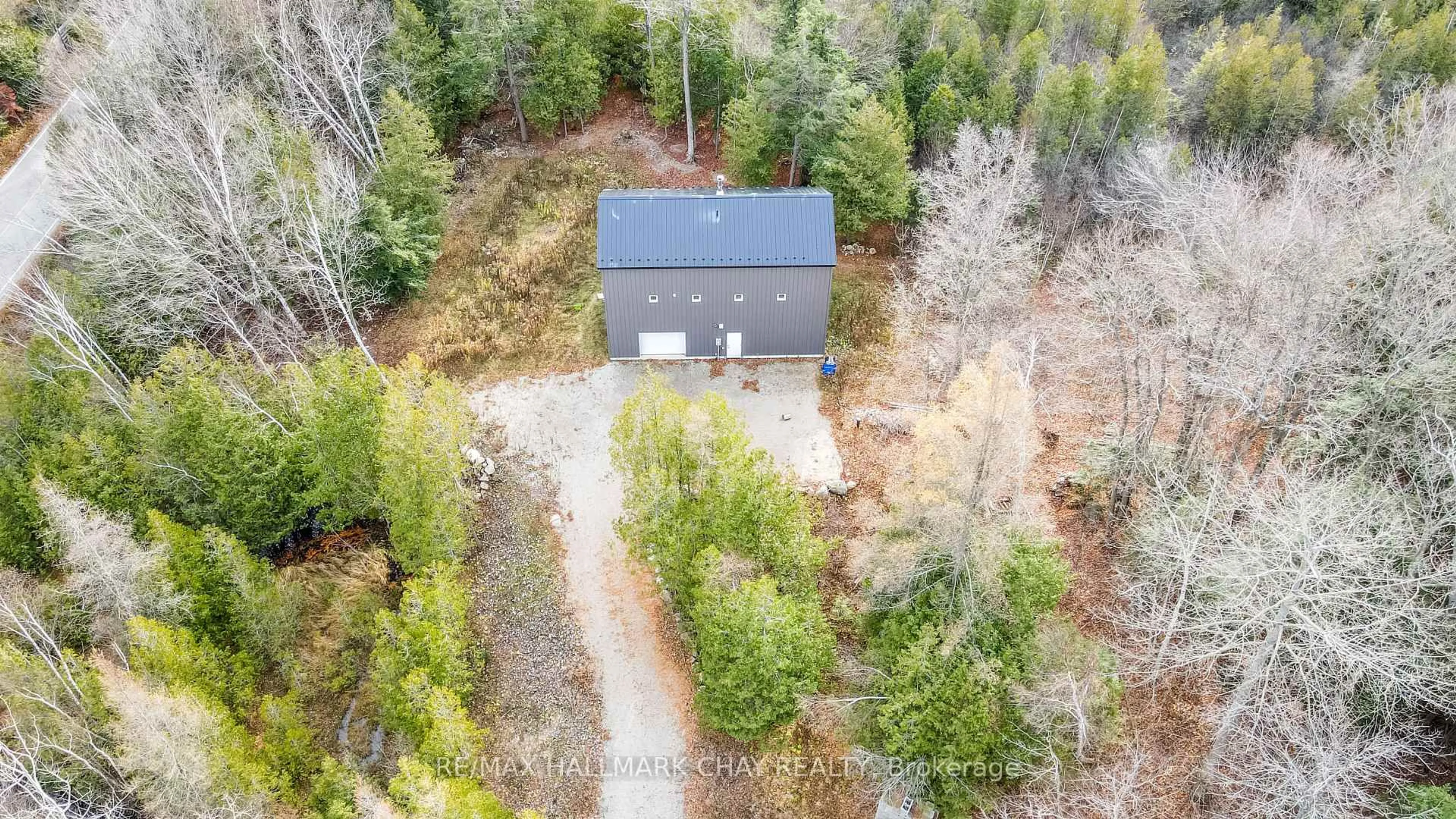 A pic from outside/outdoor area/front of a property/back of a property/a pic from drone, forest/trees view for 2576 Champlain Rd, Tiny Ontario L9M 0C9