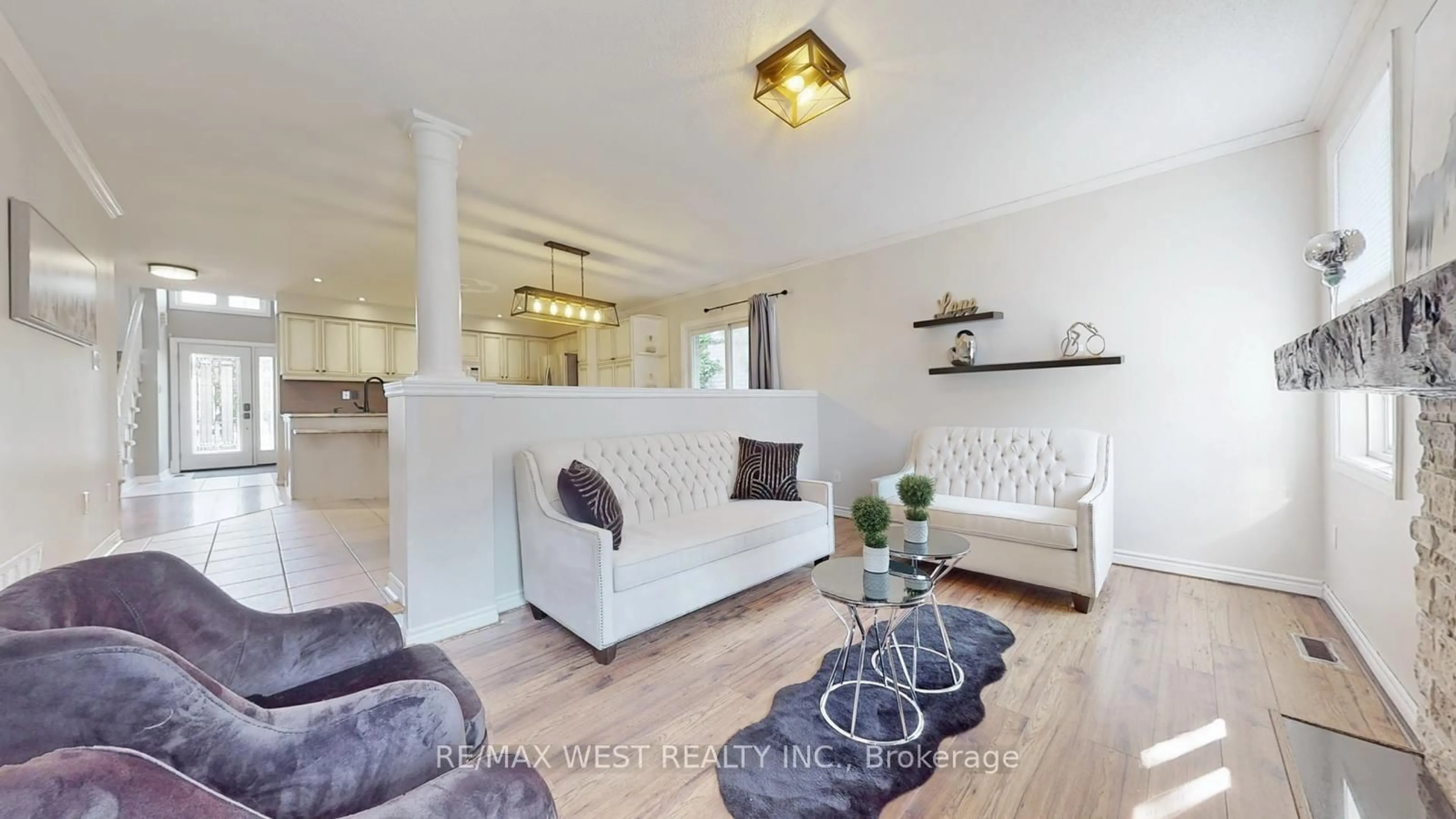 Living room with furniture, wood/laminate floor for 56 Livia Herman Way, Barrie Ontario L4M 6X1