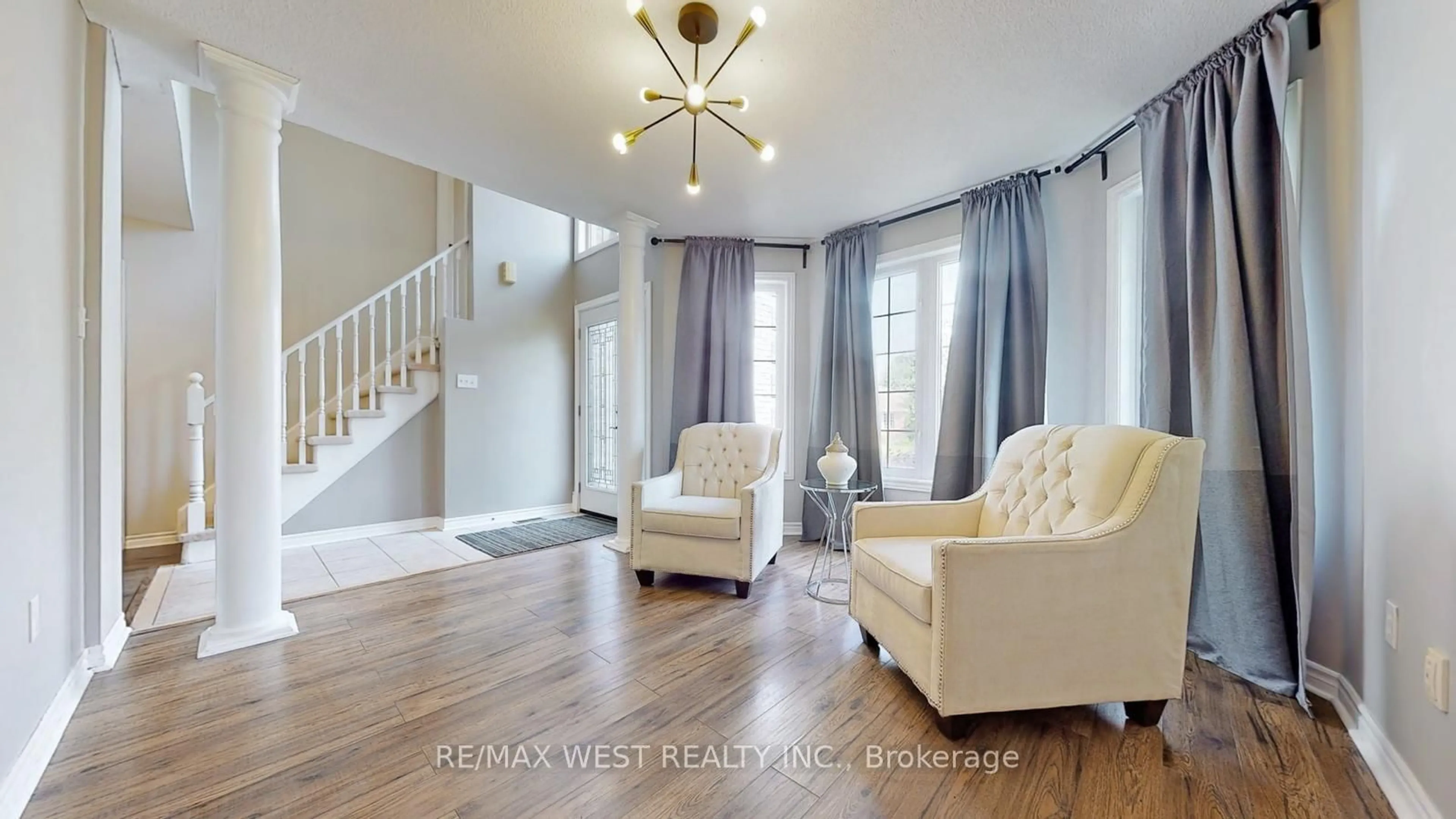 Living room with furniture, wood/laminate floor for 56 Livia Herman Way, Barrie Ontario L4M 6X1