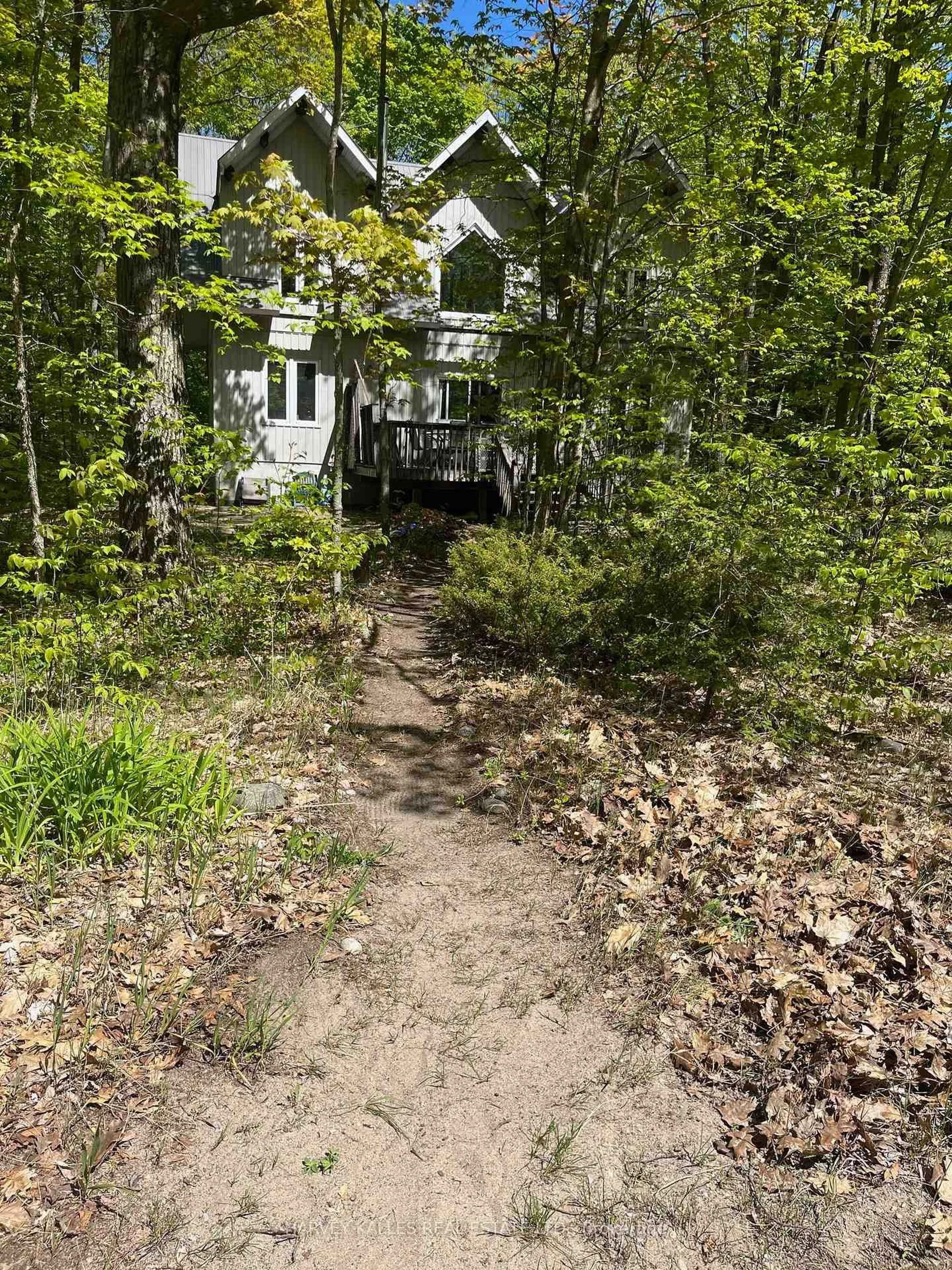 A pic from outside/outdoor area/front of a property/back of a property/a pic from drone, forest/trees view for 6 Mkwa Miikaans Lane, Christian Island 30 Ontario L9M 0A9