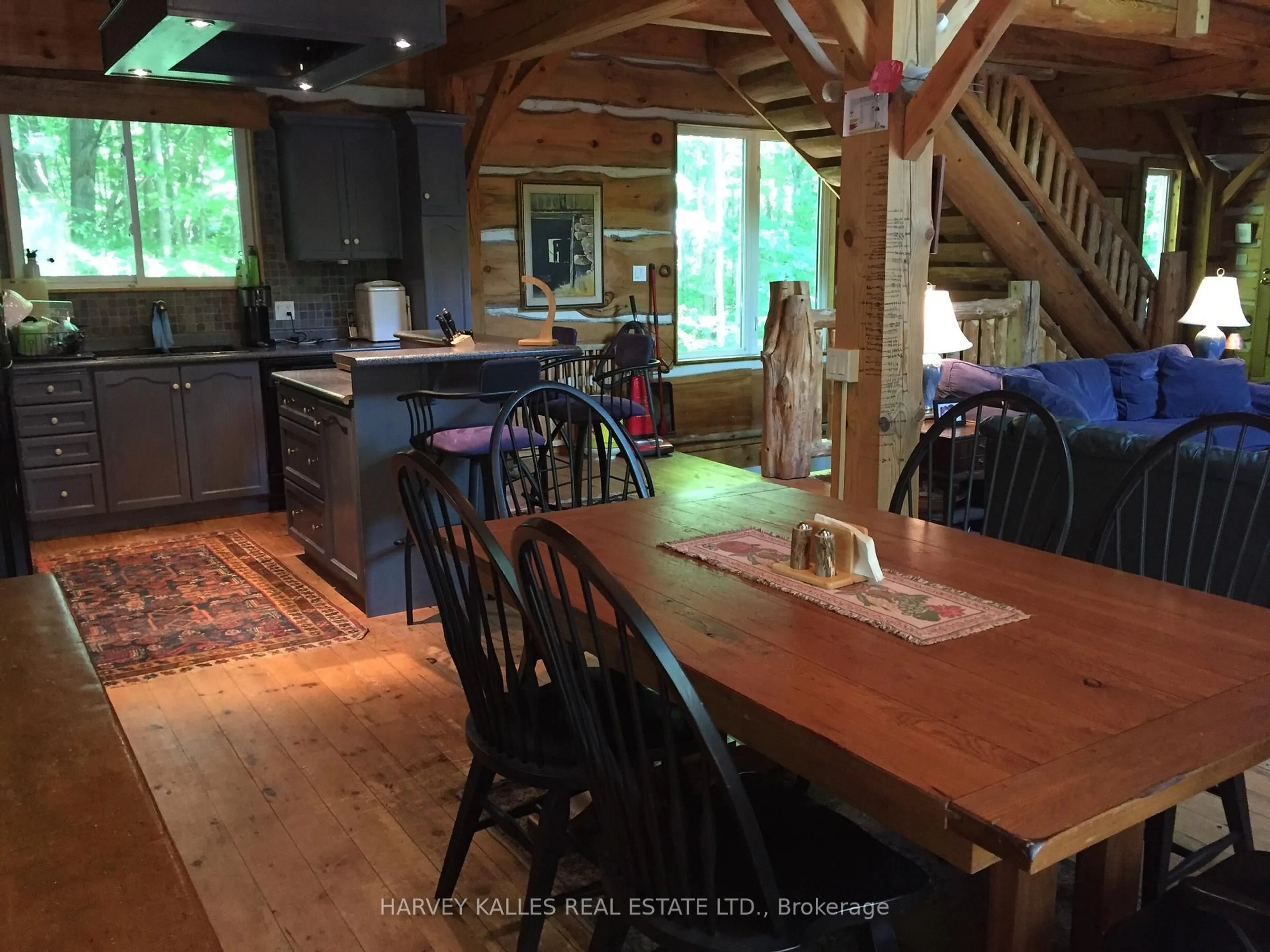 Open concept kitchen, wood/laminate floor for 6 Mkwa Miikaans Lane, Christian Island 30 Ontario L9M 0A9