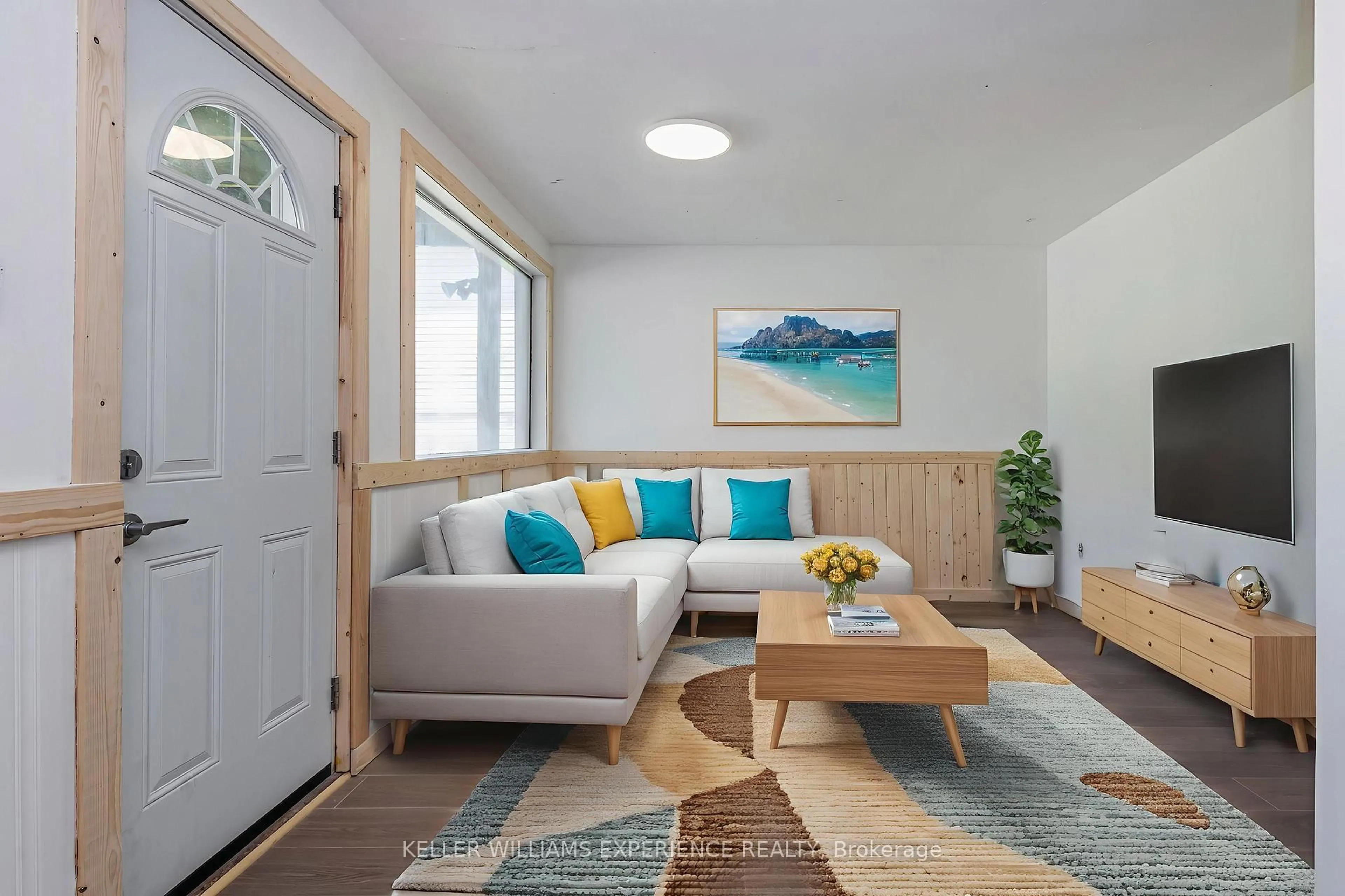 Living room with furniture, wood/laminate floor for 1153 Sylvan Glen Dr, Ramara Ontario L0K 1B0