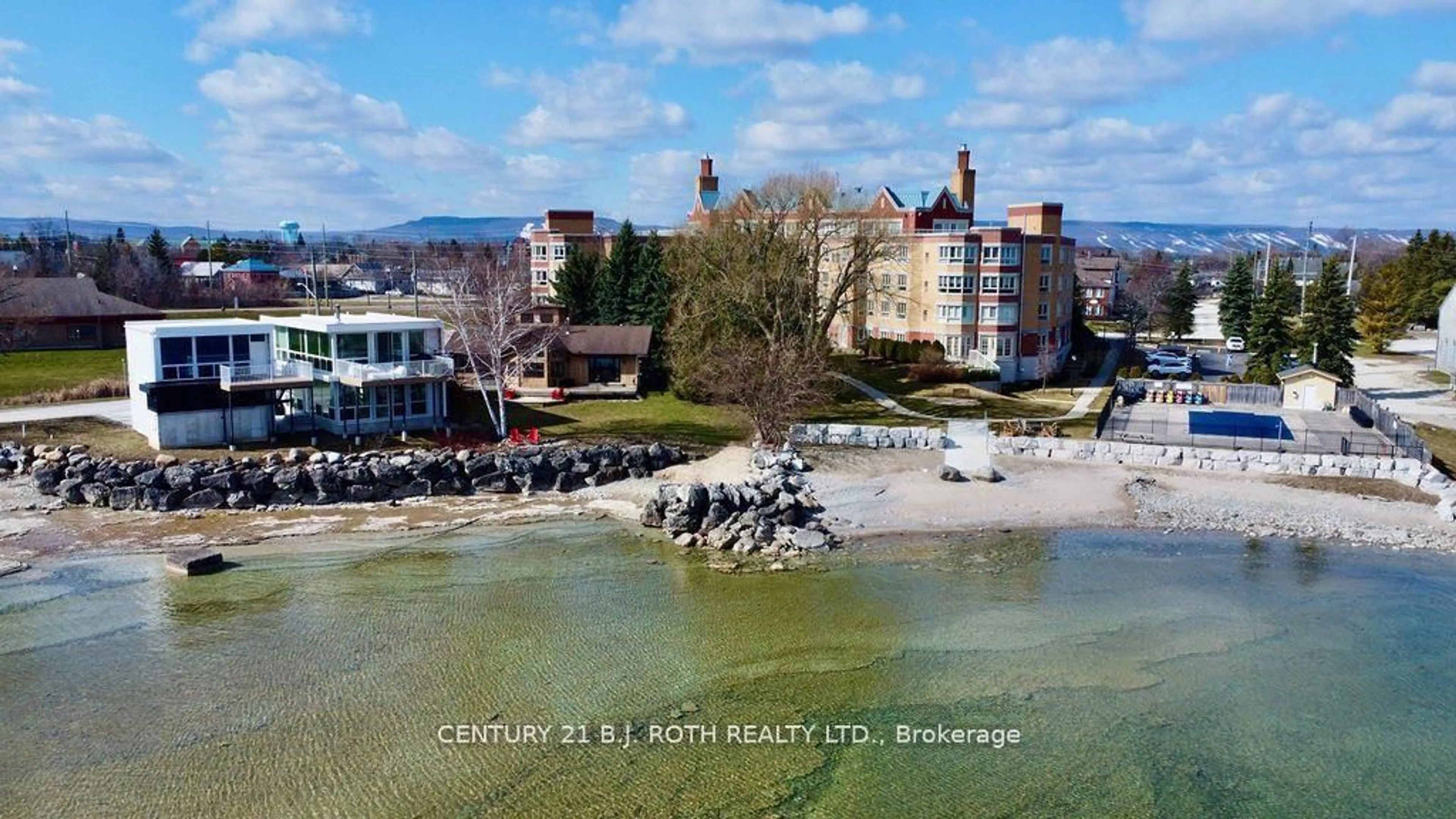 A pic from outside/outdoor area/front of a property/back of a property/a pic from drone, water/lake/river/ocean view for 16 Raglan St #304, Collingwood Ontario L9Y 4Y2