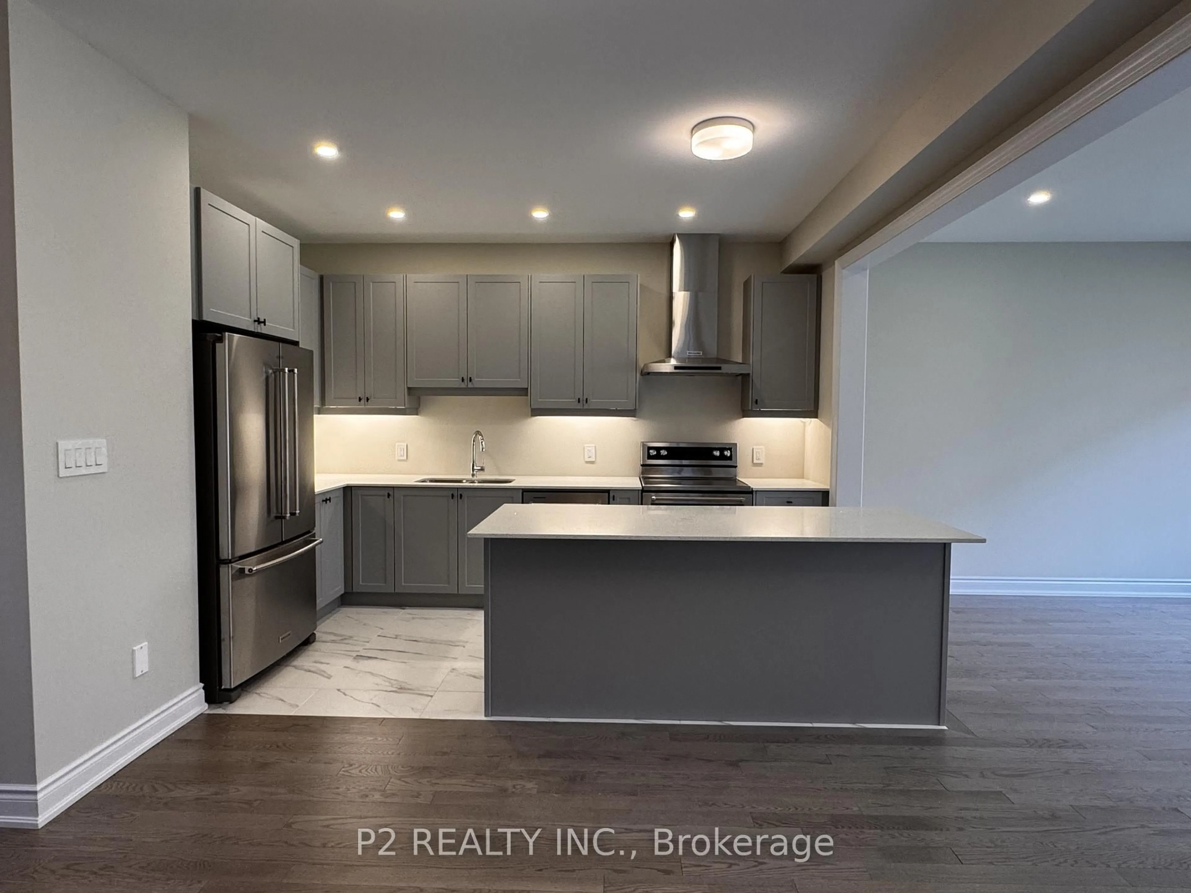 Open concept kitchen, wood/laminate floor for 25 Periwinkle Rd, Springwater Ontario L9X 2E4