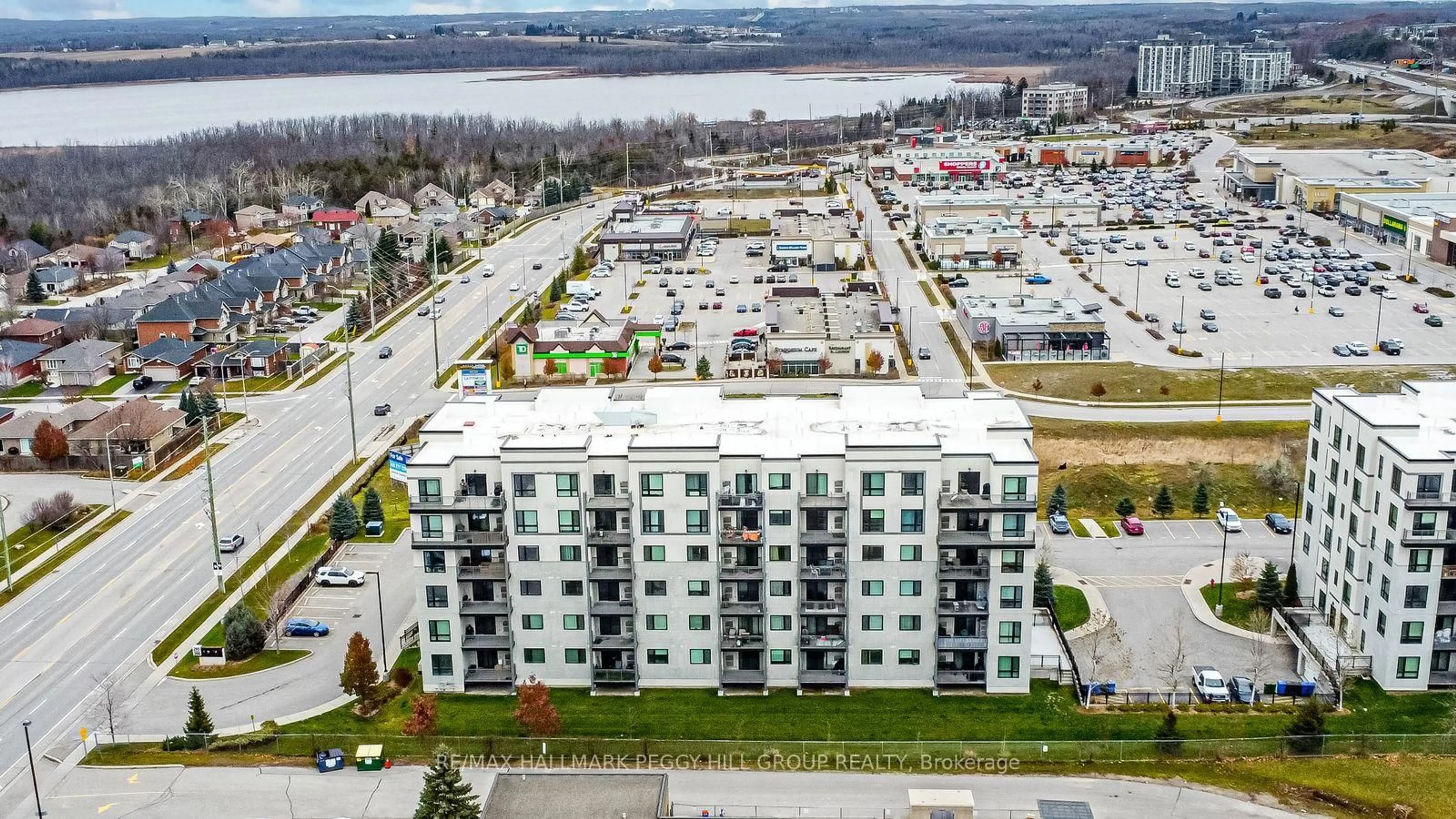 A pic from outside/outdoor area/front of a property/back of a property/a pic from drone, city buildings view from balcony for 295 Cundles Rd #404, Barrie Ontario L4M 0K8