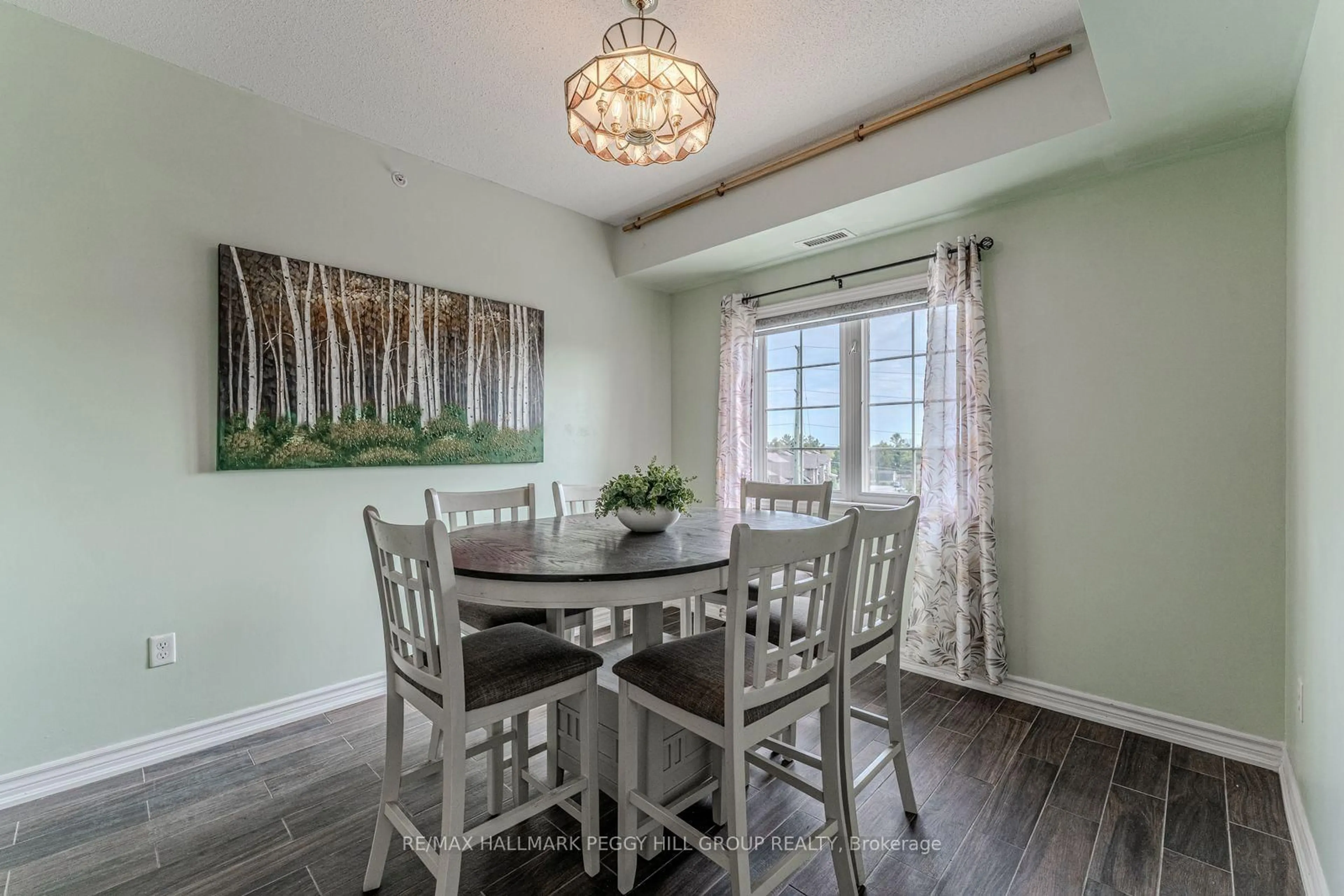 Dining room, wood/laminate floor for 40 Ferndale Dr #402, Barrie Ontario L4N 2L3