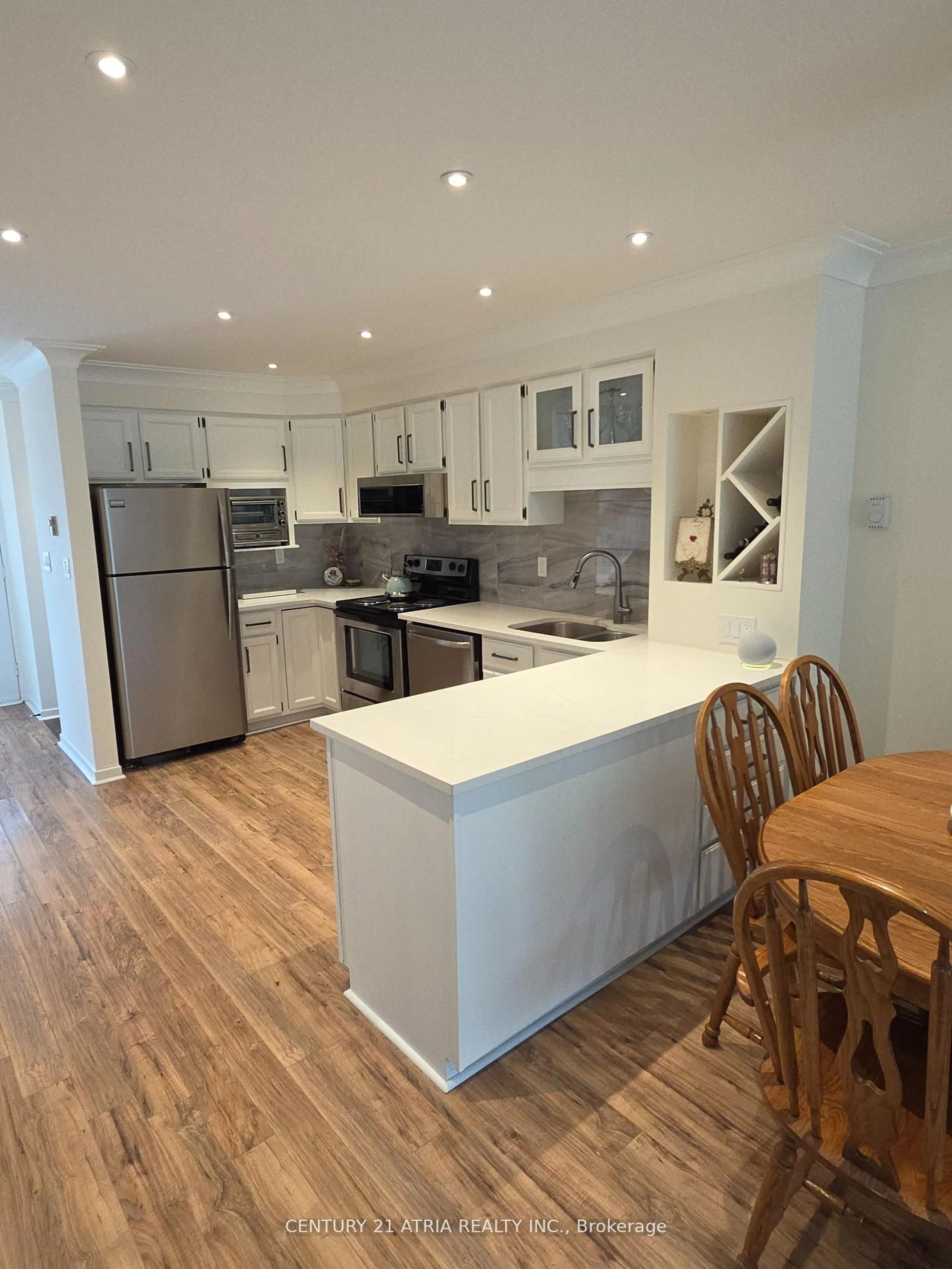 Open concept kitchen, wood/laminate floor for 4 Paradise Blvd #24, Ramara Ontario L0K 1B0