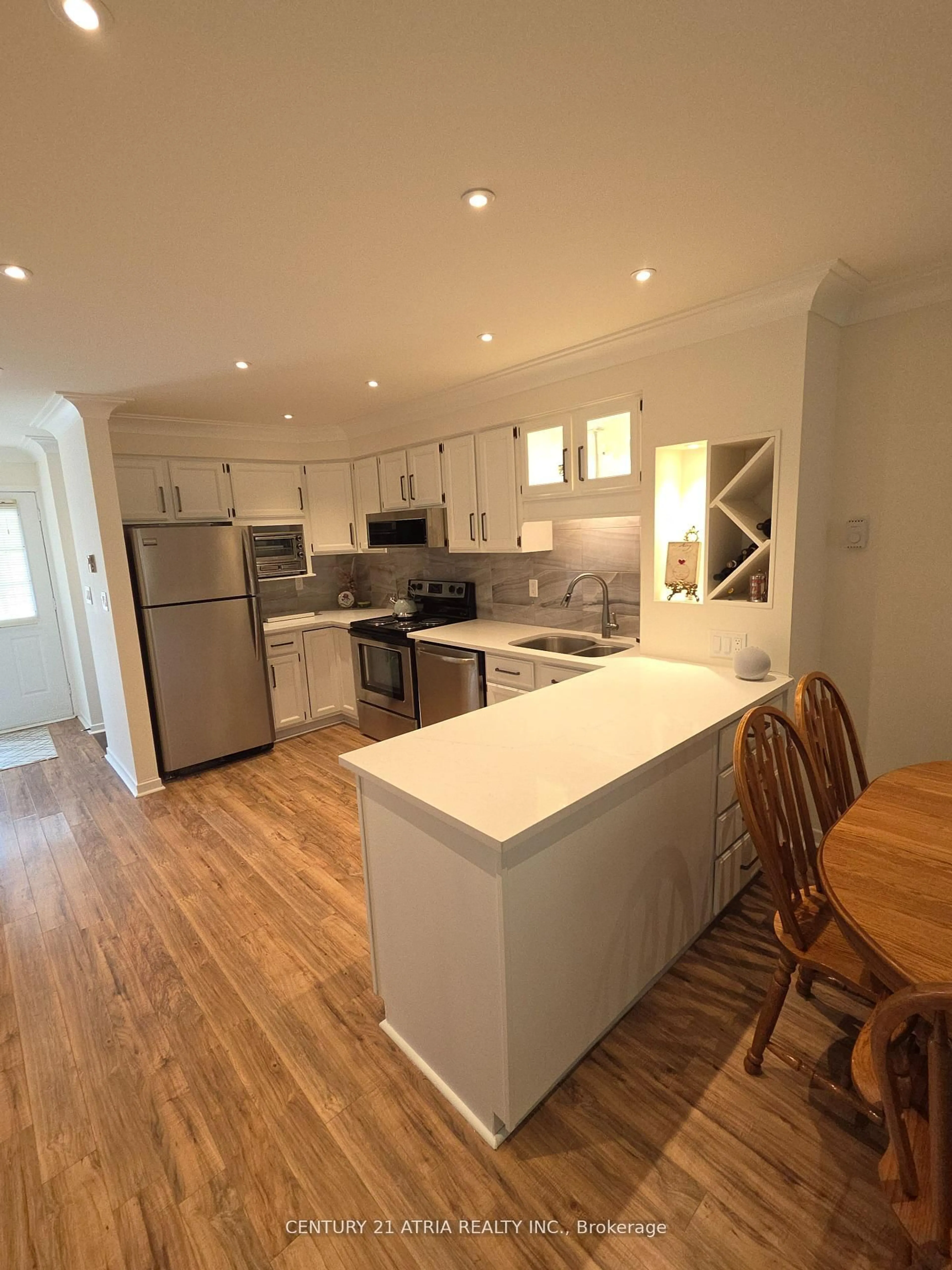 Open concept kitchen, wood/laminate floor for 4 Paradise Blvd #24, Ramara Ontario L0K 1B0