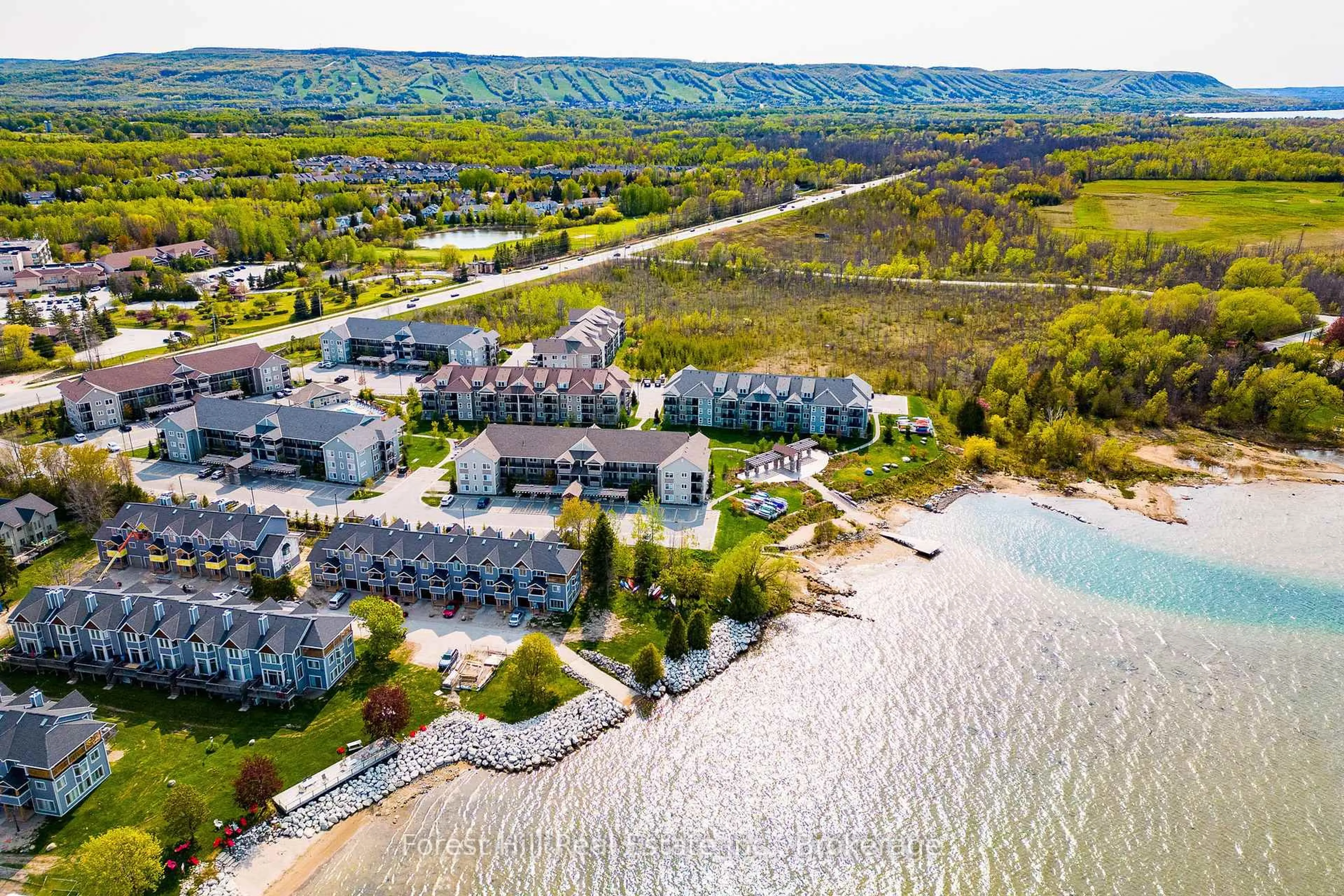 A pic from outside/outdoor area/front of a property/back of a property/a pic from drone, water/lake/river/ocean view for 2 ANCHORAGE Cres #108, Collingwood Ontario L9Y 0Y6