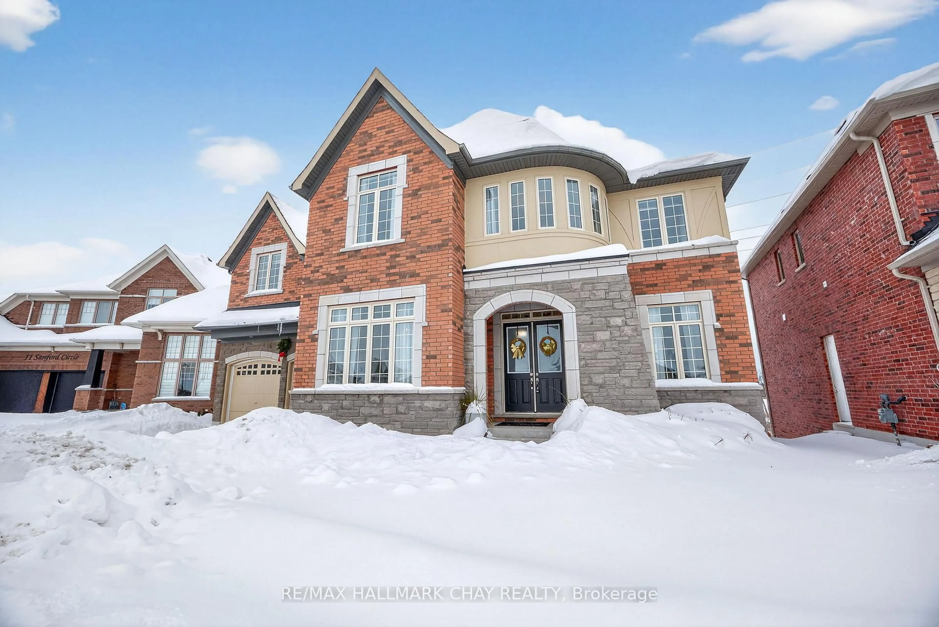 Home with brick exterior material, street for 13 Sanford Circ, Springwater Ontario L9X 2A8