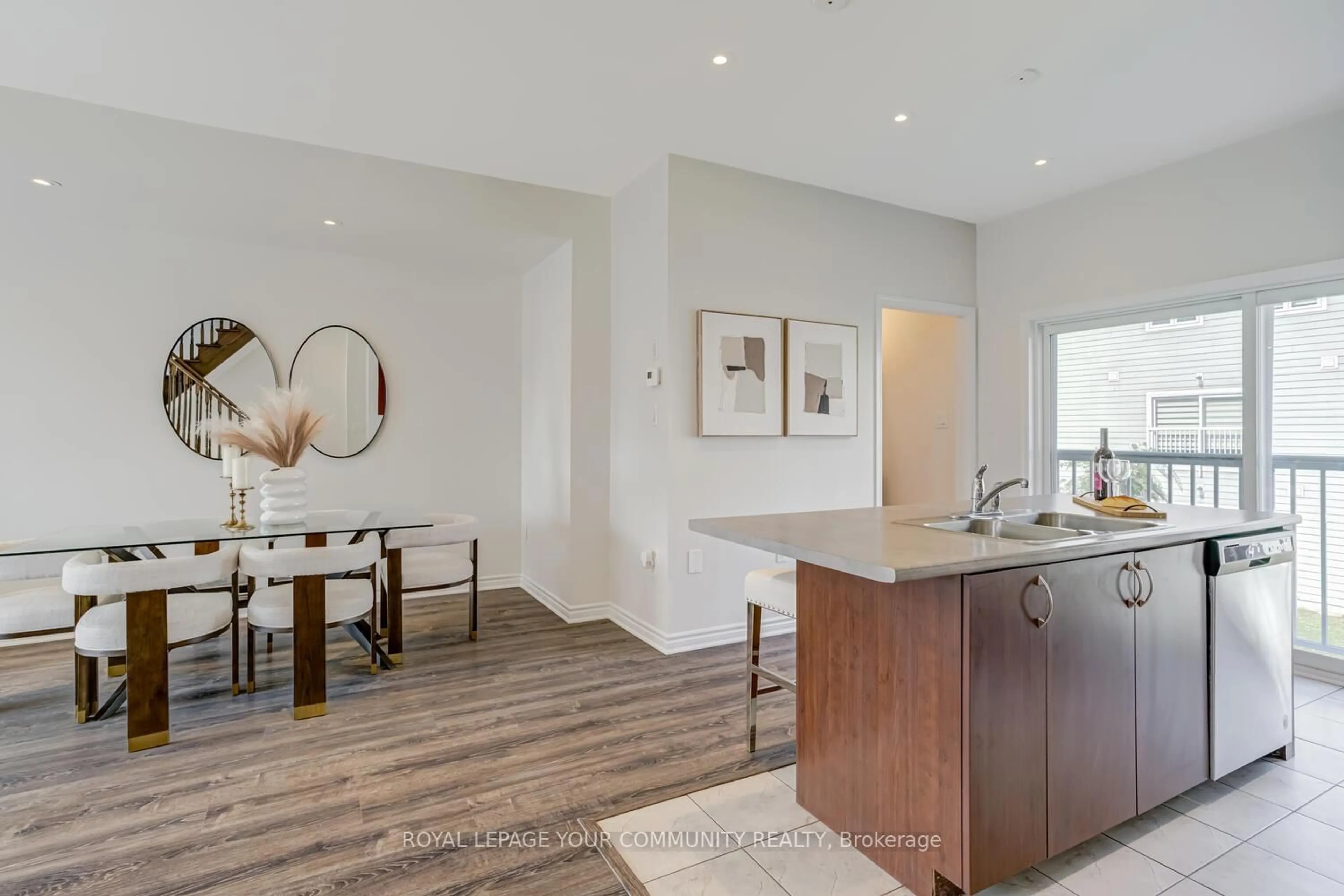 Open concept kitchen, wood/laminate floor for 25 Shelburne Ave, Wasaga Beach Ontario L9Z 2X2