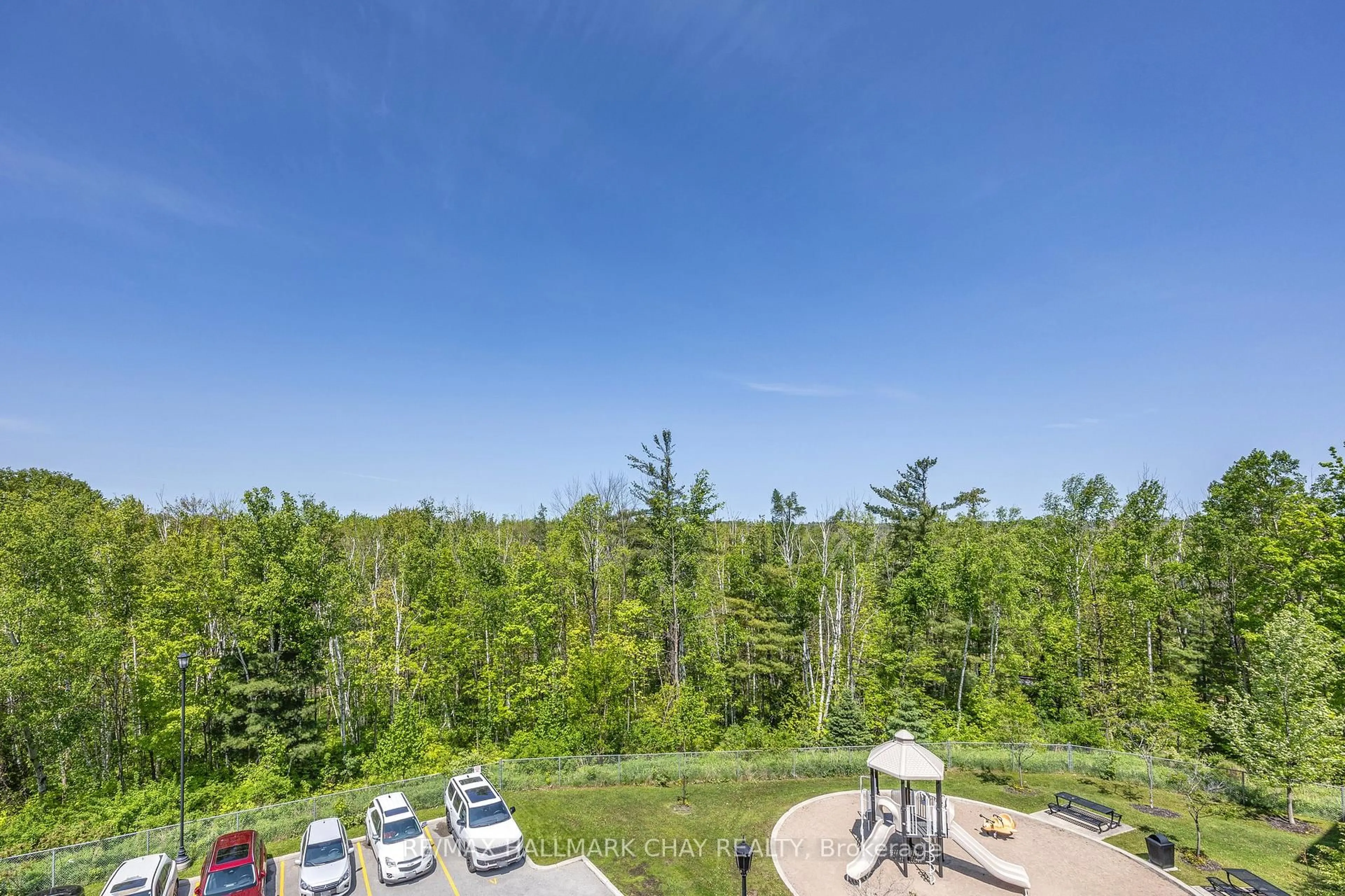 A pic from outside/outdoor area/front of a property/back of a property/a pic from drone, forest/trees view for 40 Ferndale Dr #407, Barrie Ontario L4N 2L3
