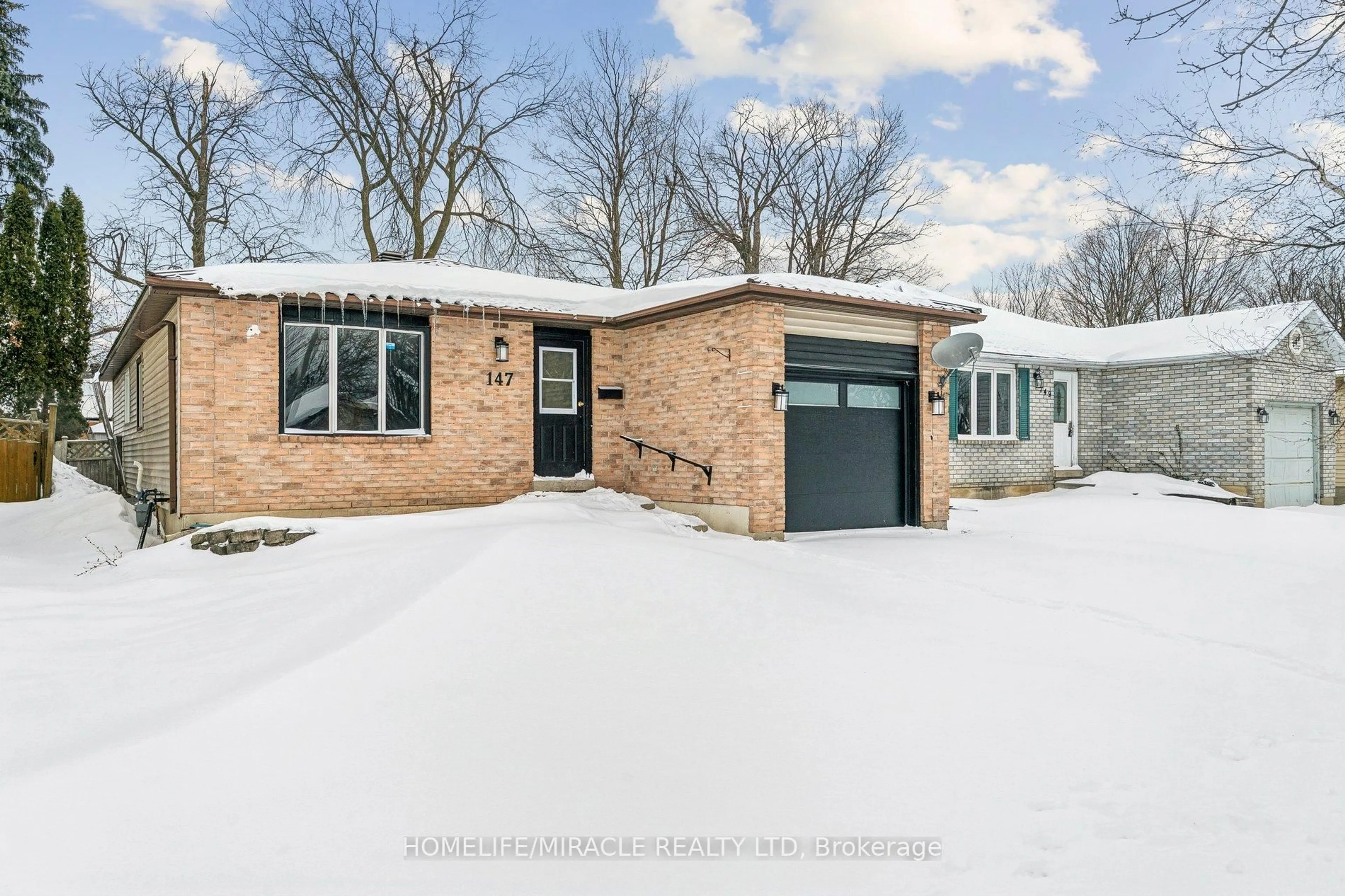 Home with brick exterior material, street for 147 Hickling Tr, Barrie Ontario L4M 5T7