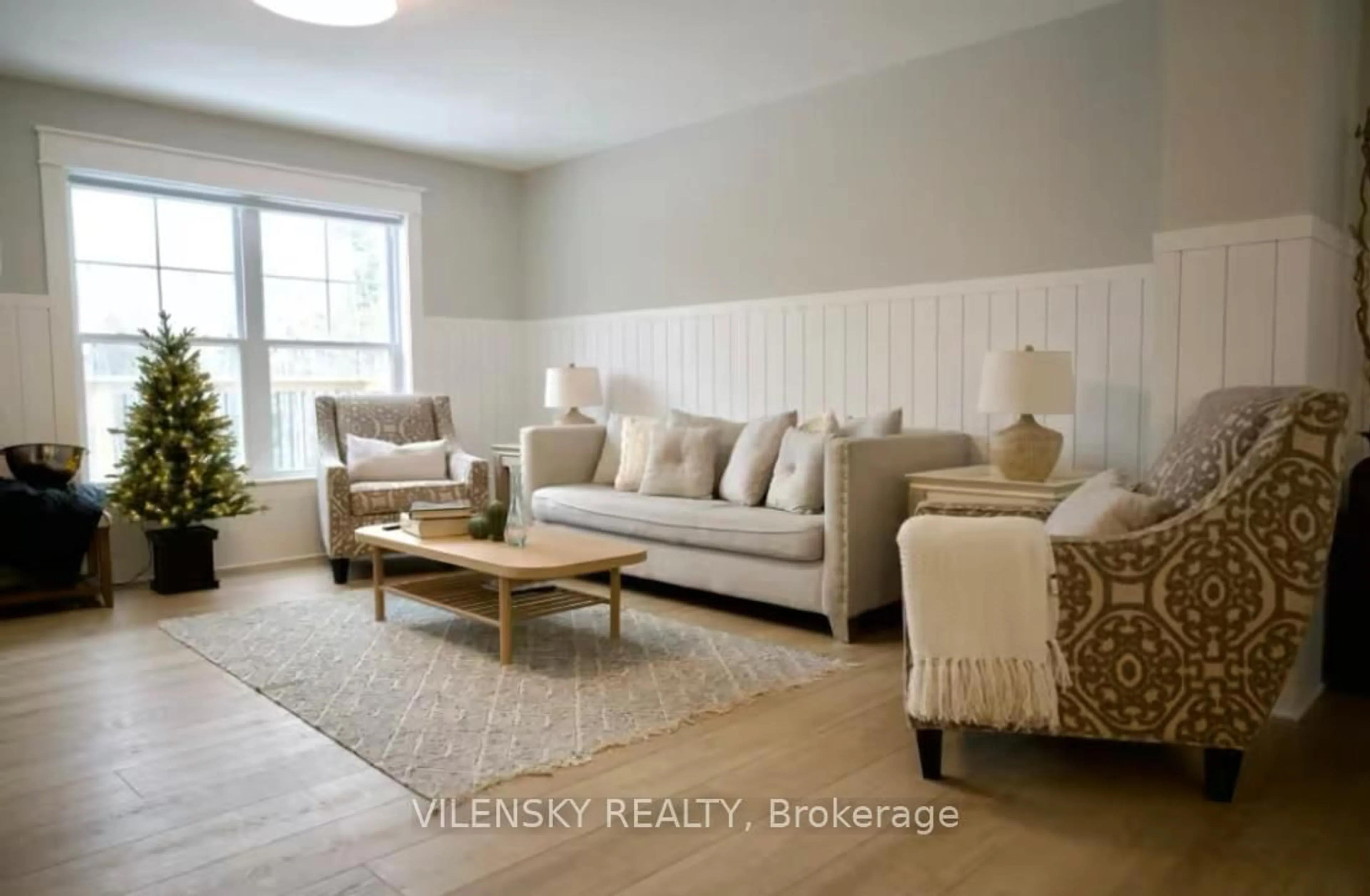 Living room with furniture, wood/laminate floor for 1728 CHAMPLAIN Rd, Tiny Ontario L9M 0C1