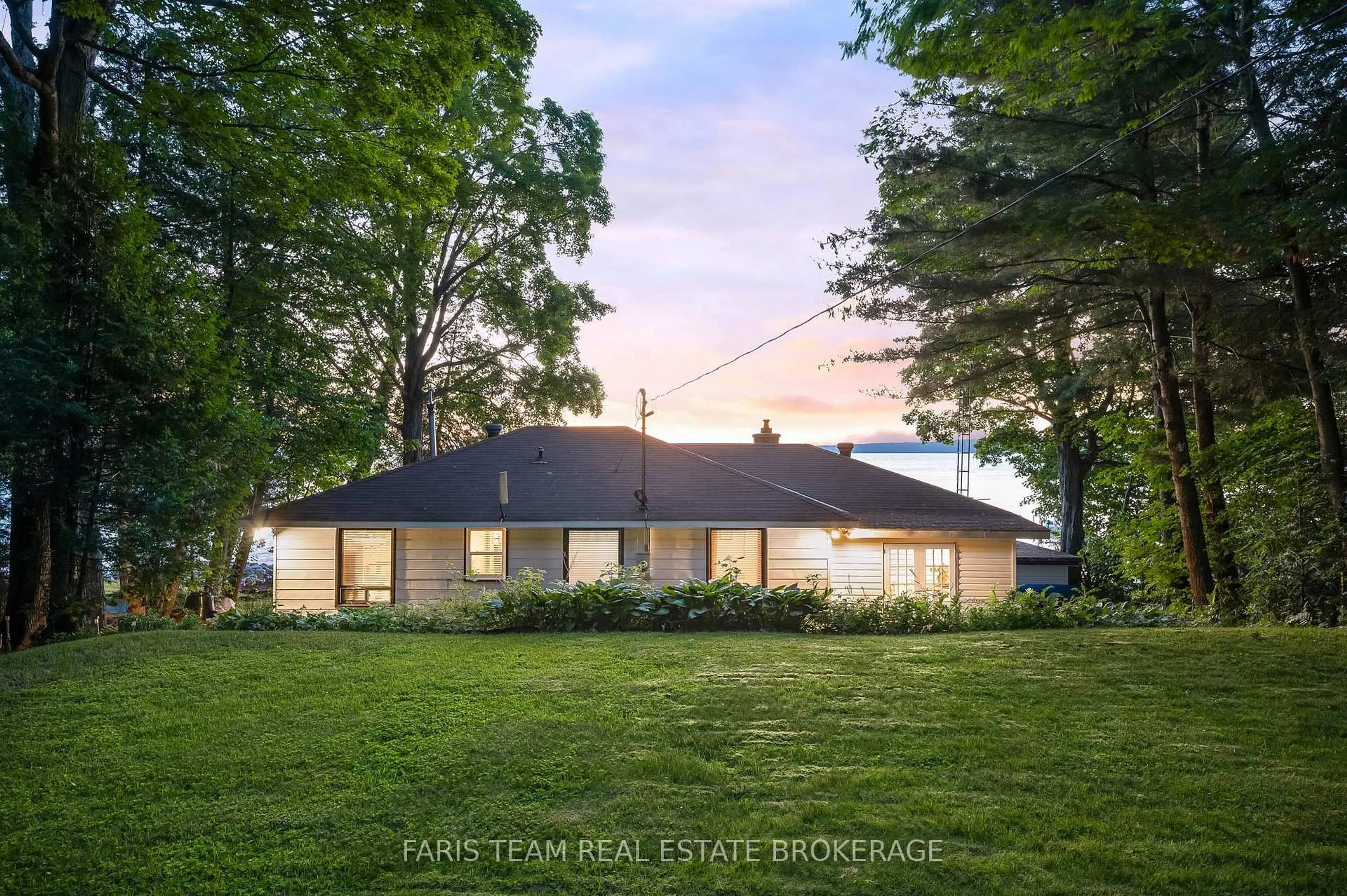 A pic from outside/outdoor area/front of a property/back of a property/a pic from drone, street for 1697 Champlain Rd, Tiny Ontario L9M 0E3