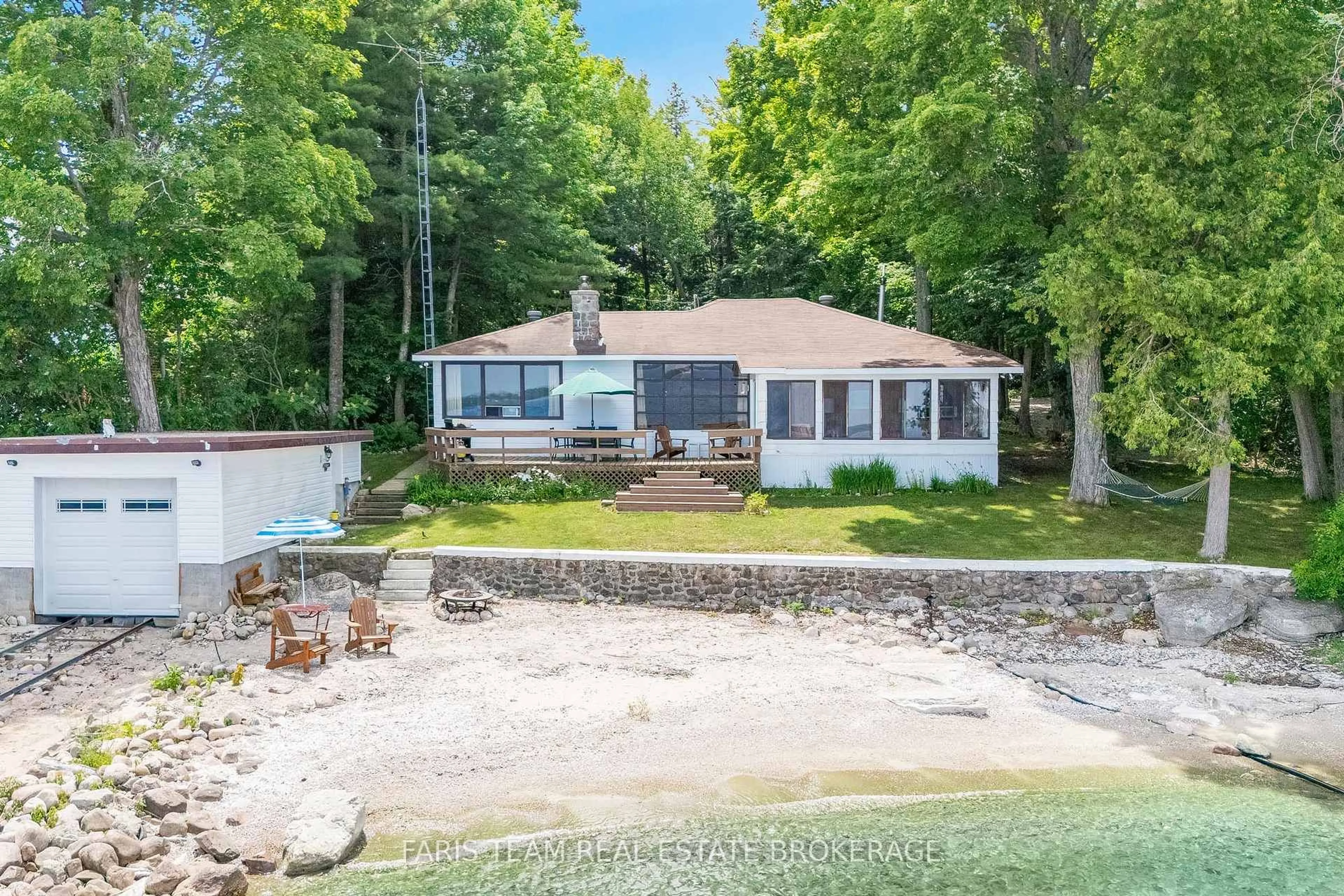 A pic from outside/outdoor area/front of a property/back of a property/a pic from drone, water/lake/river/ocean view for 1697 Champlain Rd, Tiny Ontario L9M 0E3