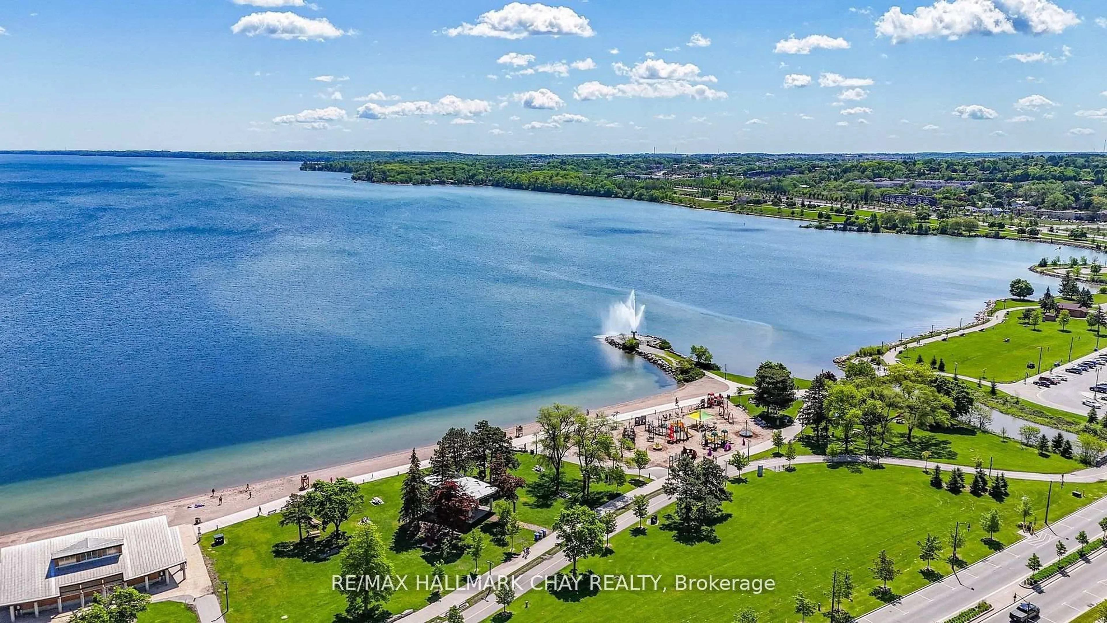 A pic from outside/outdoor area/front of a property/back of a property/a pic from drone, water/lake/river/ocean view for 65 Ellen St #205, Barrie Ontario L4N 3A5