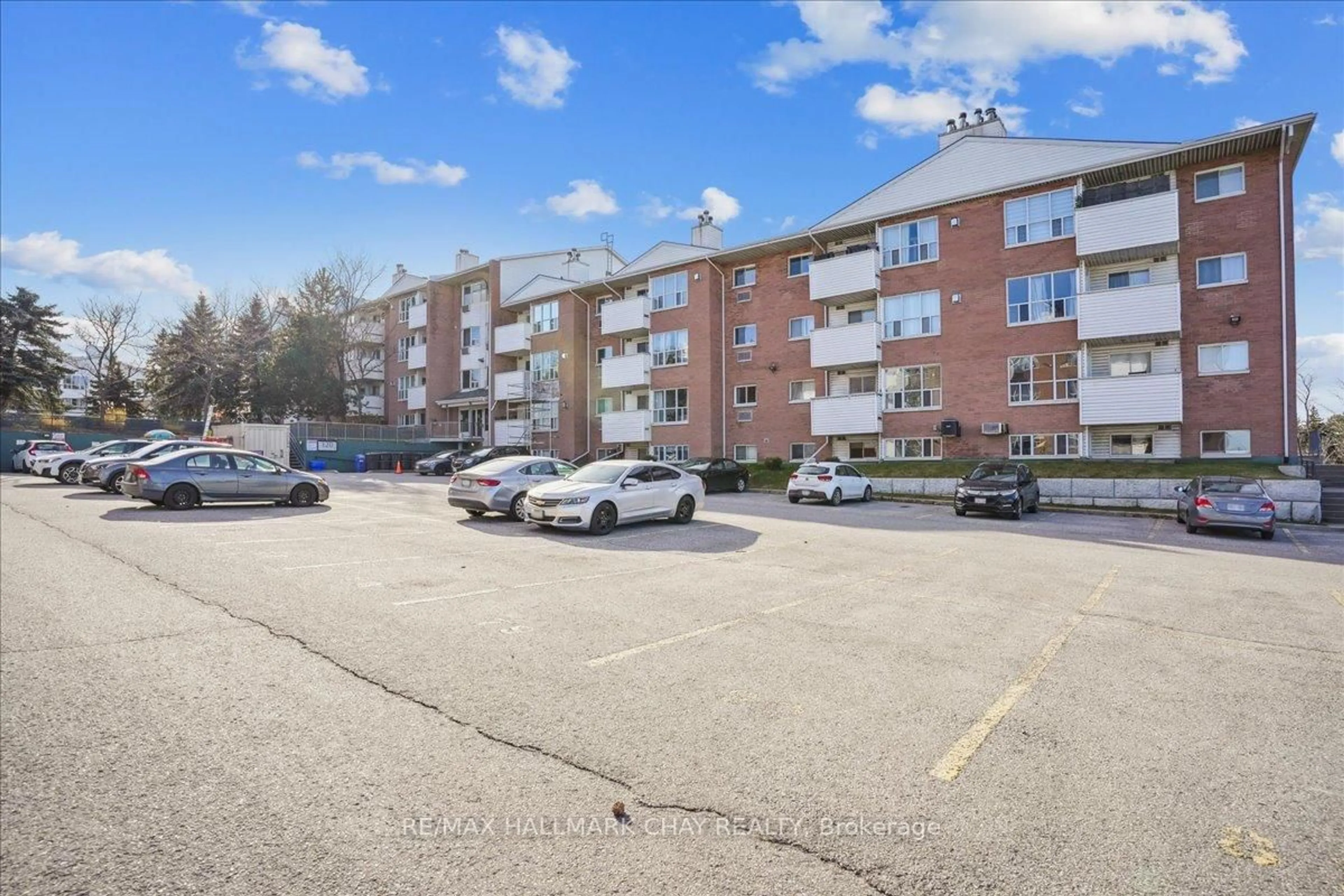 A pic from outside/outdoor area/front of a property/back of a property/a pic from drone, street for 120 Bell Farm Rd #206, Barrie Ontario L4M 6J2